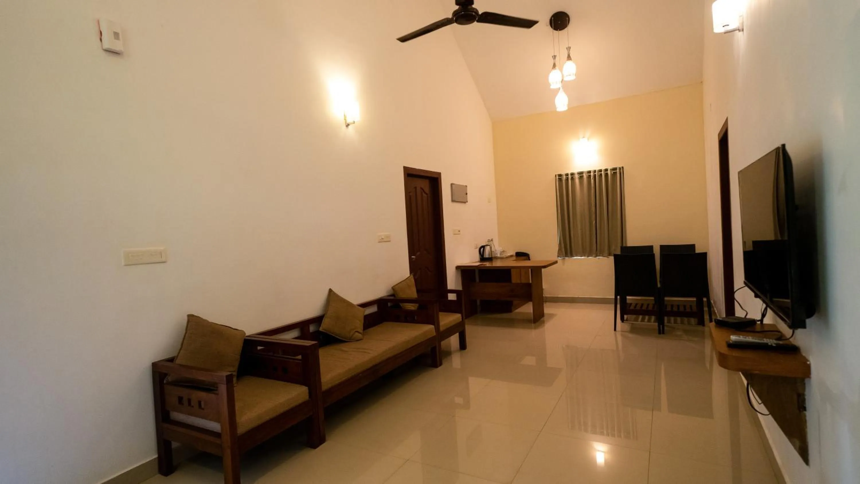 Communal lounge/ TV room in Vythiri Holiday Resort, Wayanad