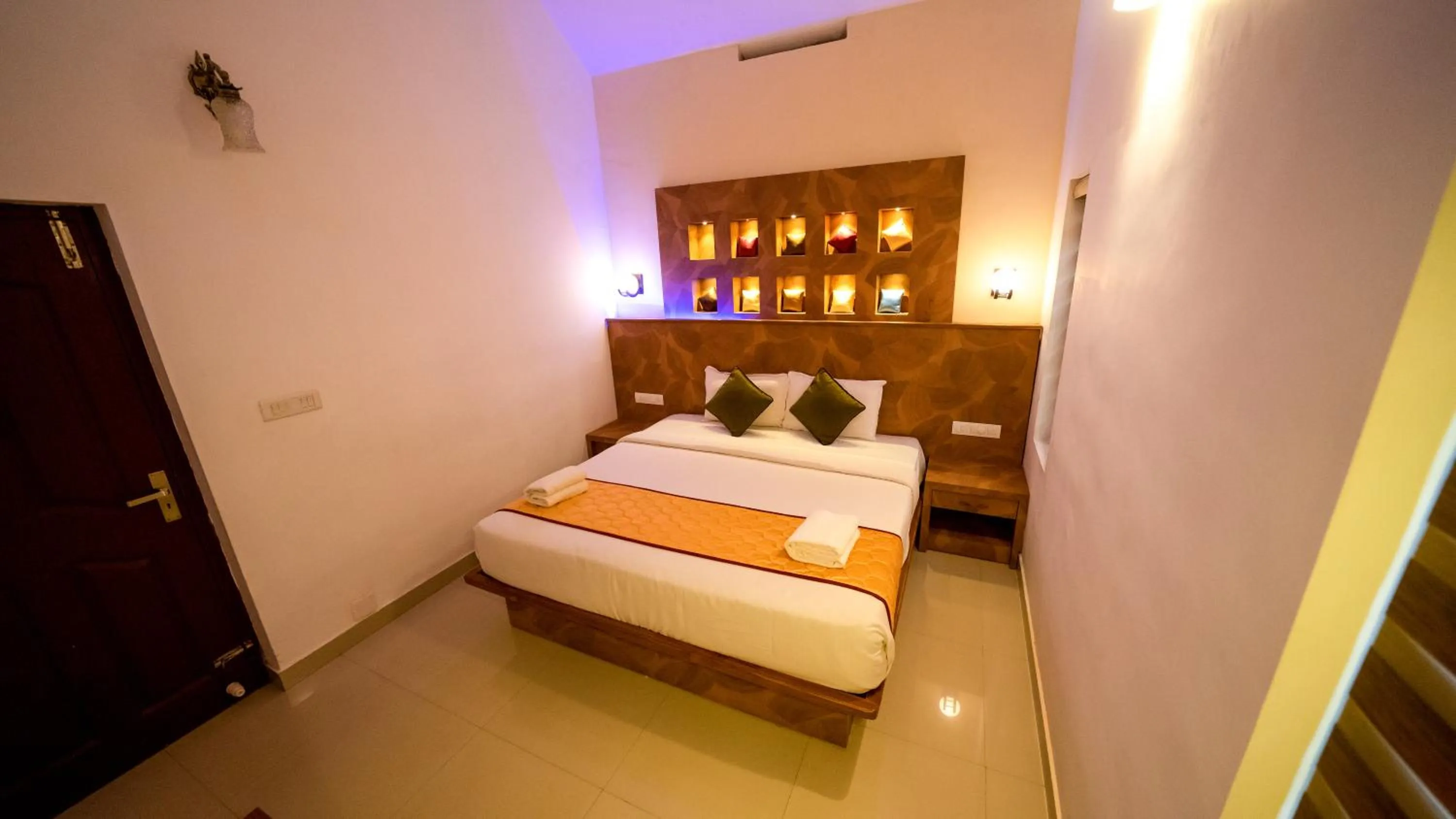 Bed in Vythiri Holiday Resort, Wayanad