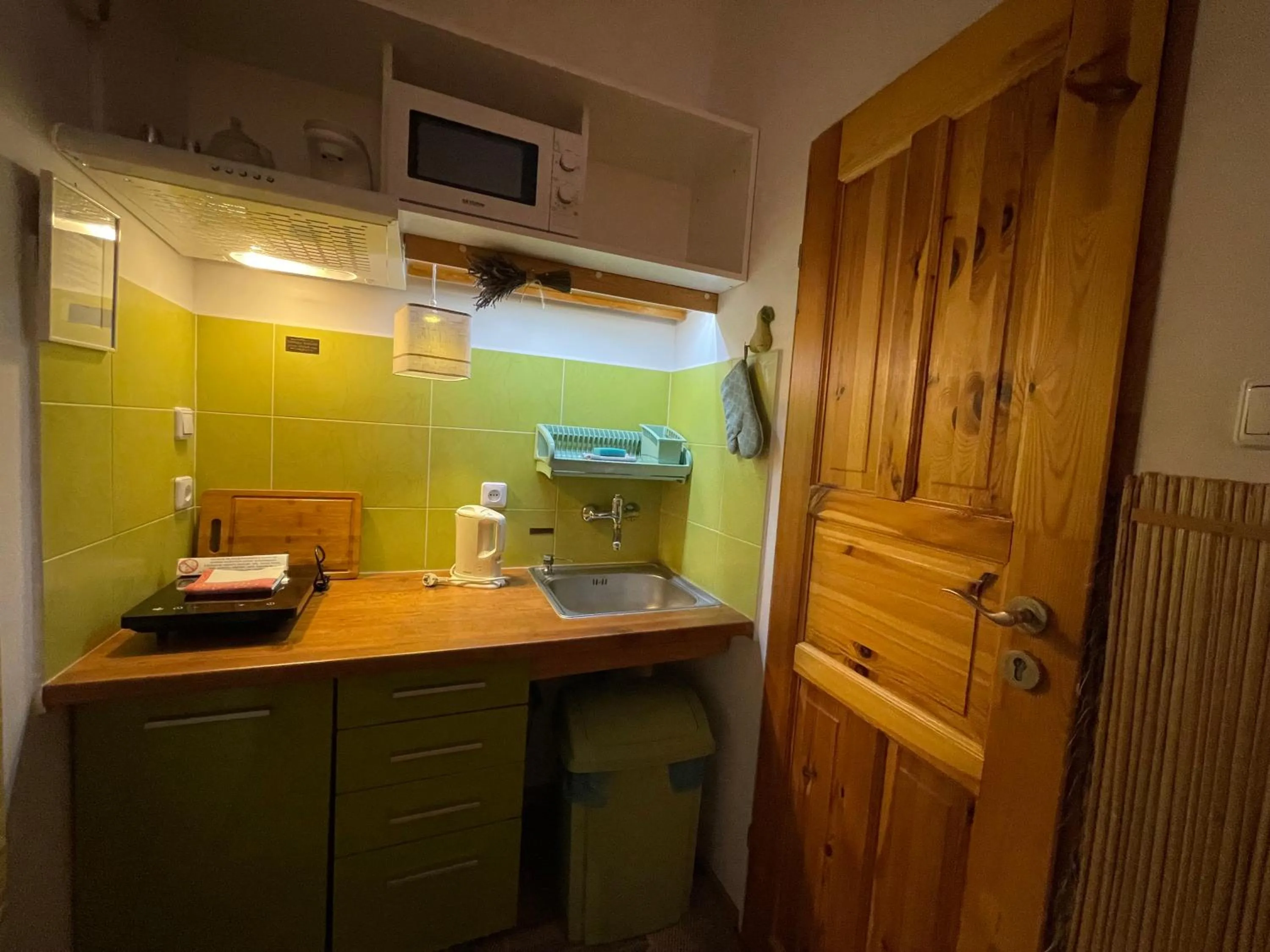 Kitchen or kitchenette in Apartamenty pod Wiciokrzewem
