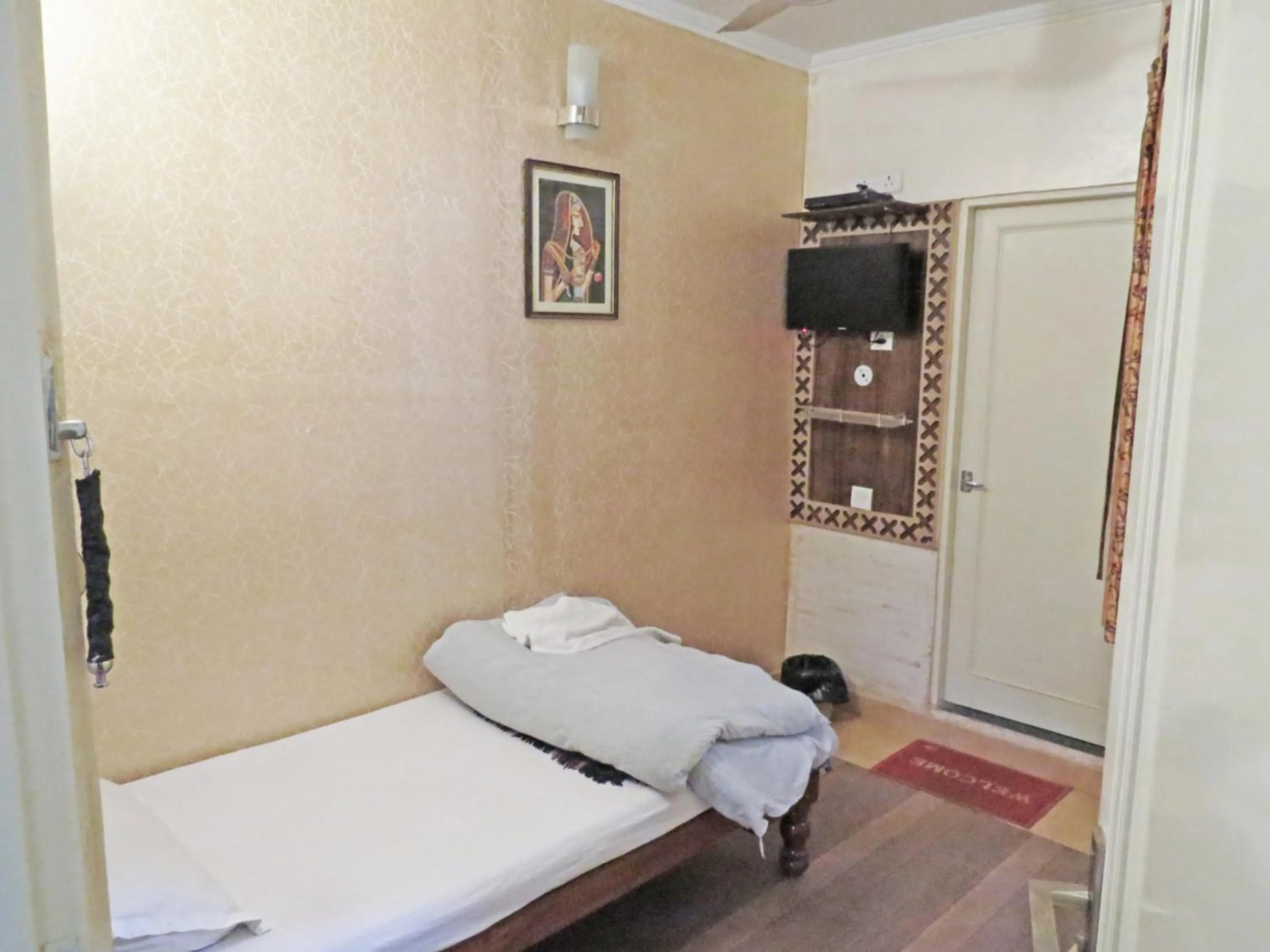 Bed in Hotel Rangoli