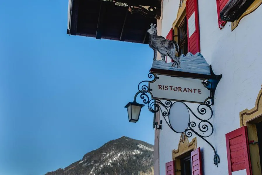 Property logo or sign in Posthotel Sachrang