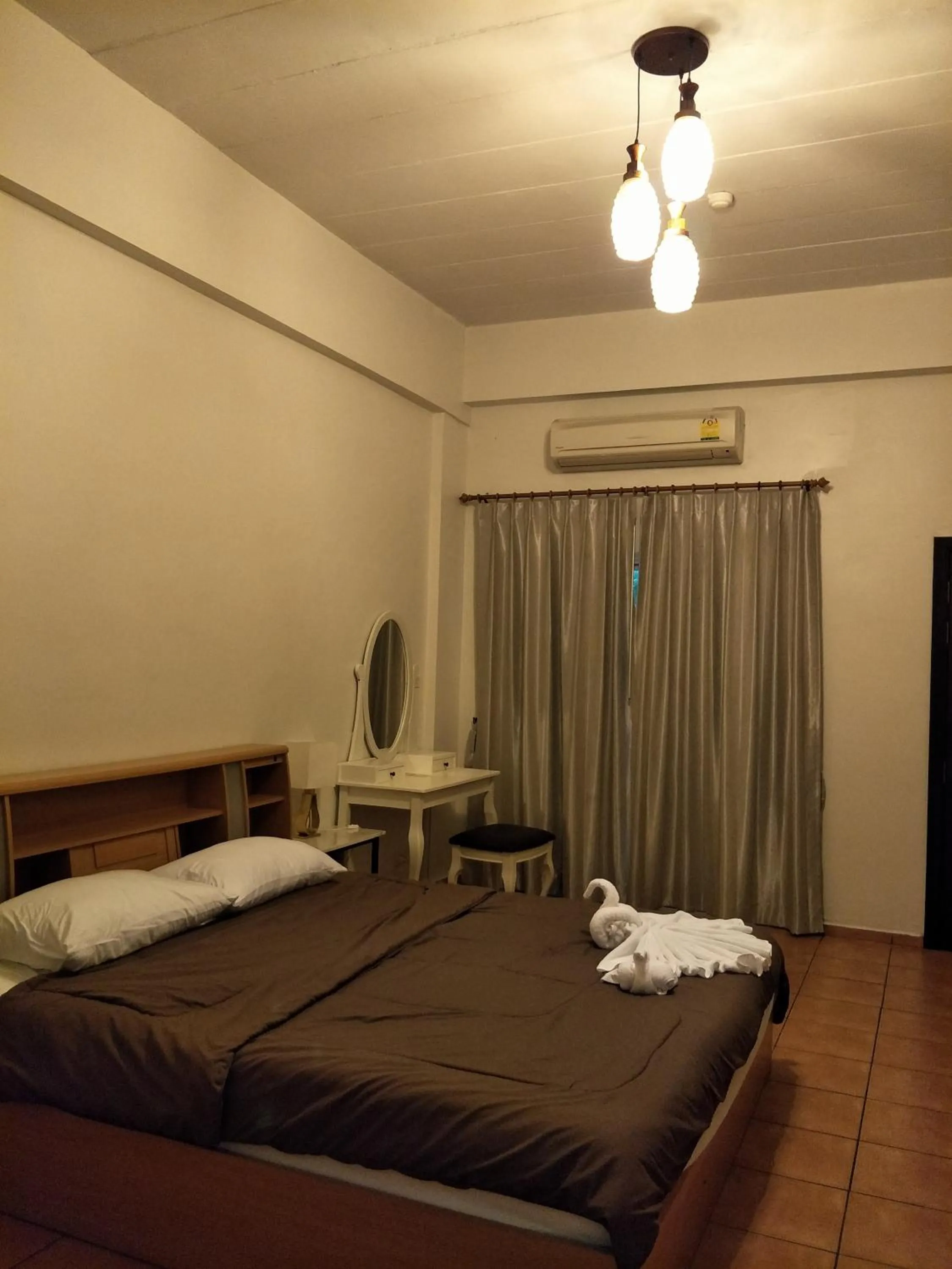 Bed in Lomsabai Apartments