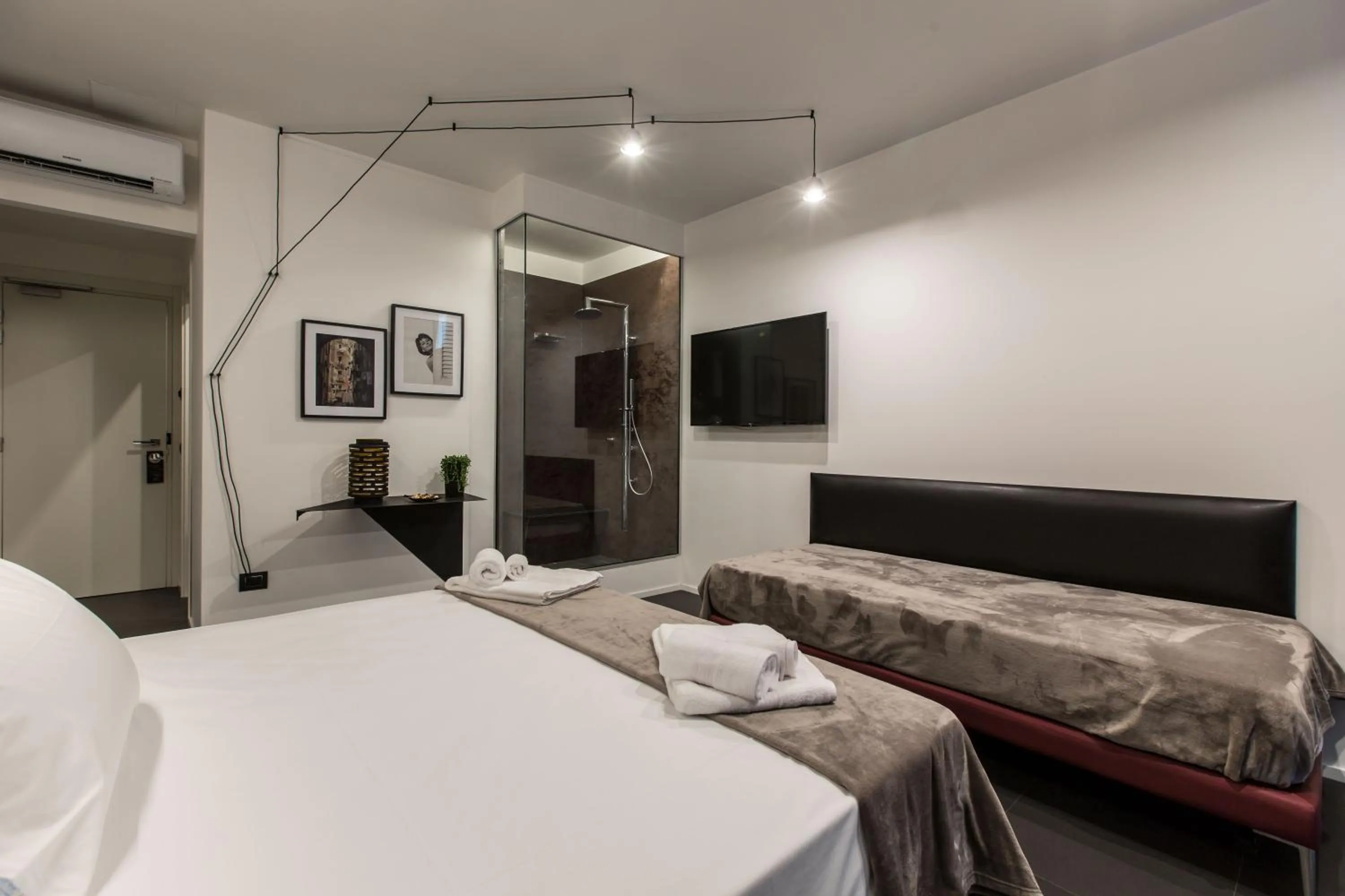 Bed in The Boutique Napoli Suite