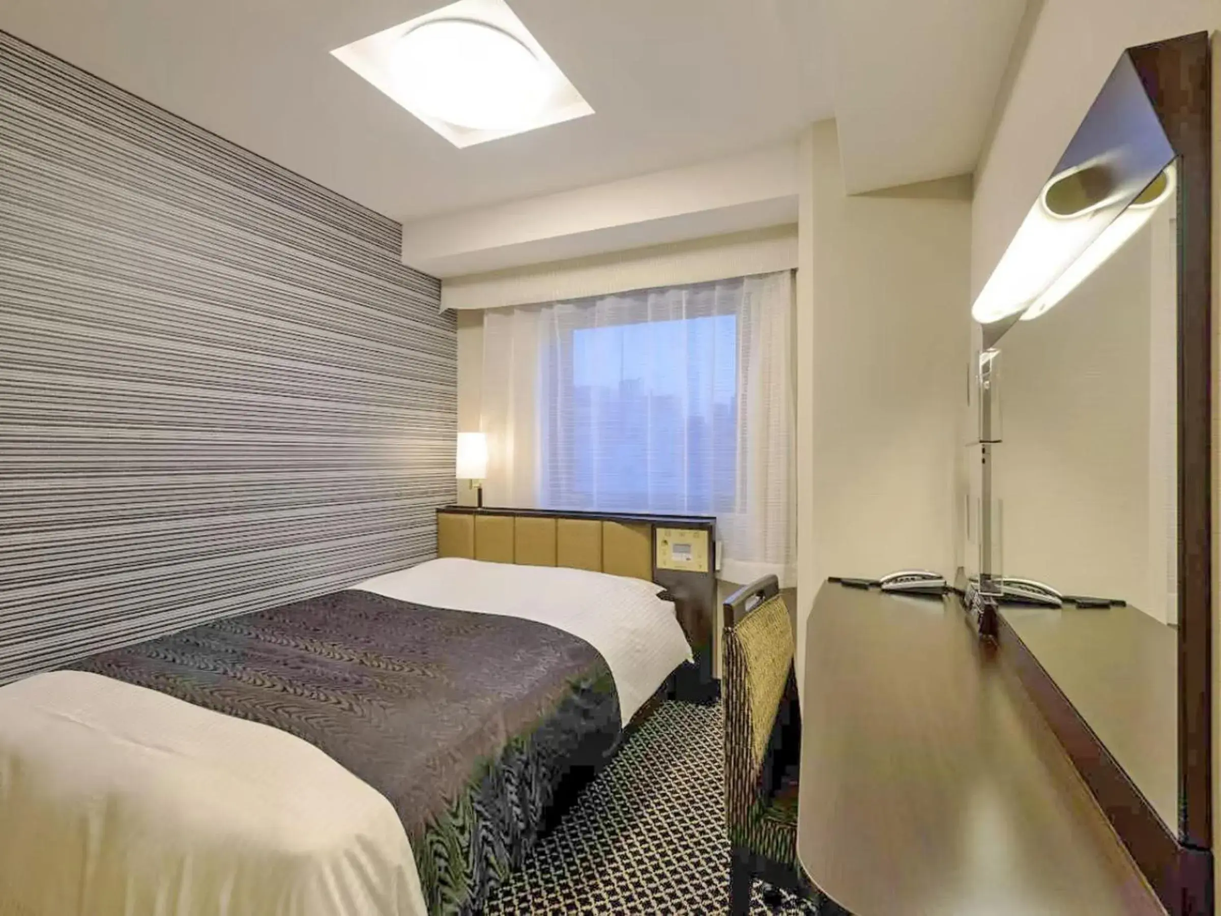 Bed in APA Hotel Namba Ekihigashi Bed in APA Hotel Namba Ekihigashi