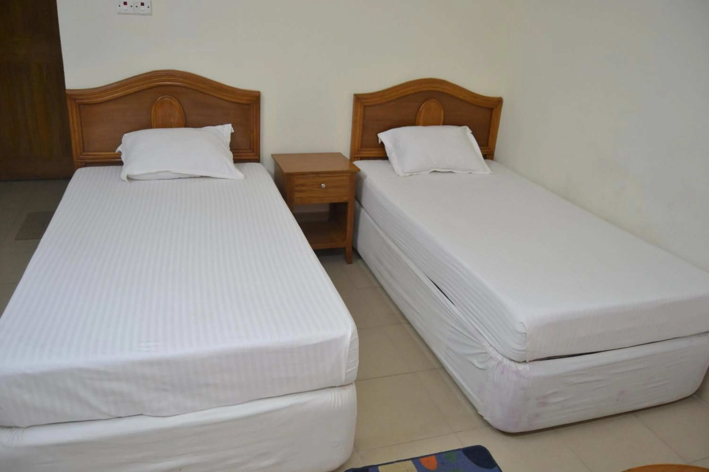 Bed in Hotel Marine Plaza