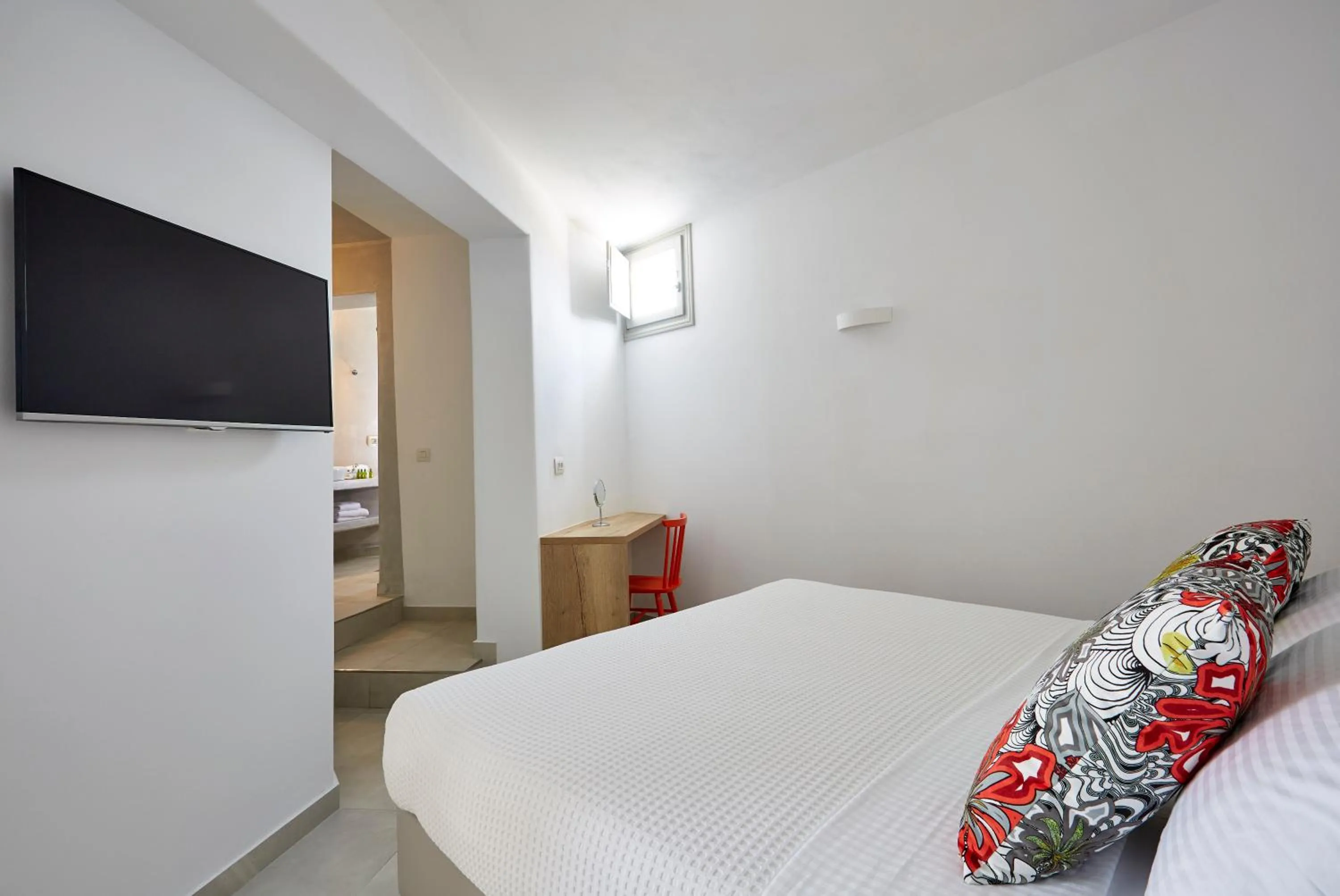 Bed in Aperanto Suites