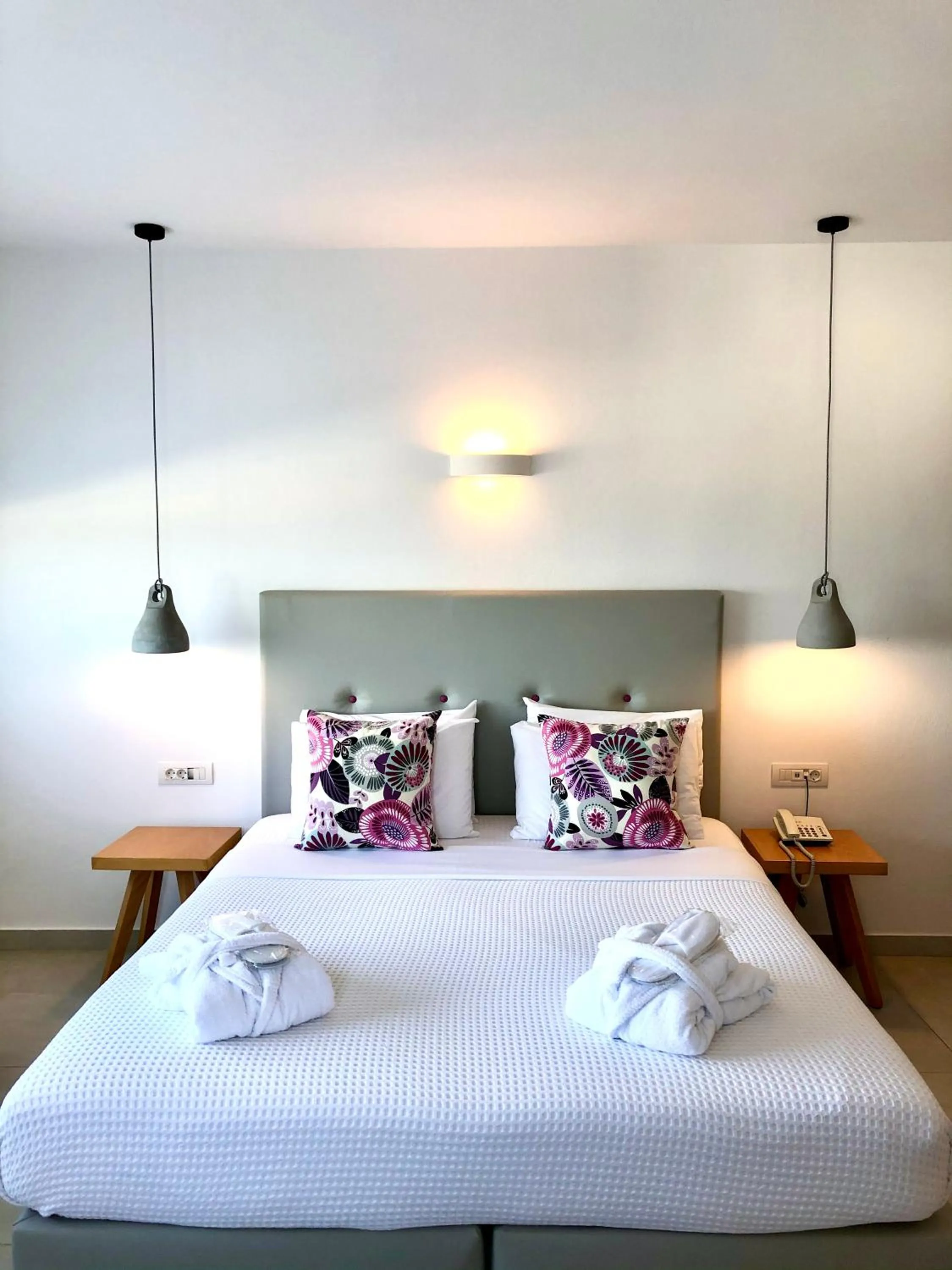 Bed in Aperanto Suites