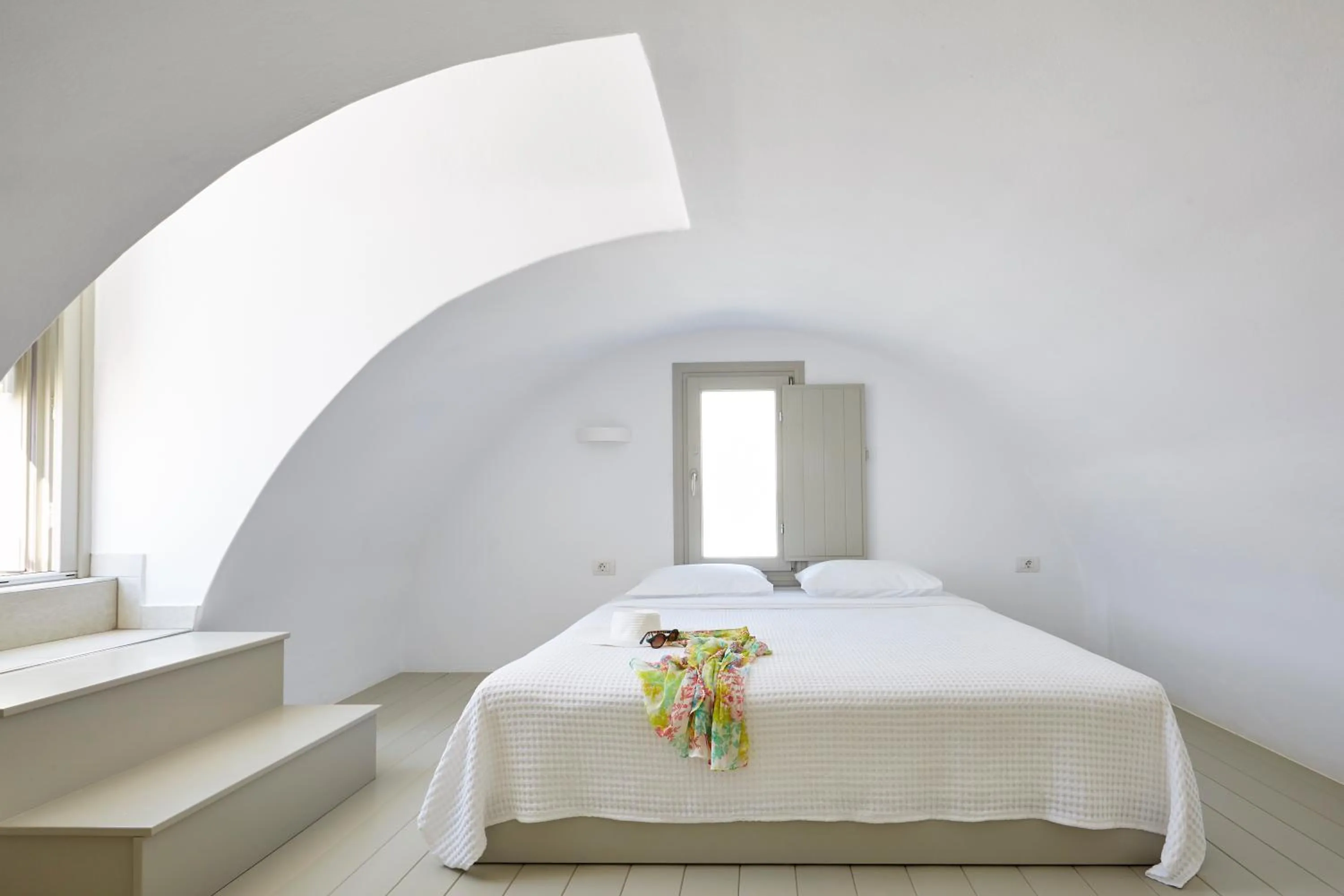 Bed in Aperanto Suites
