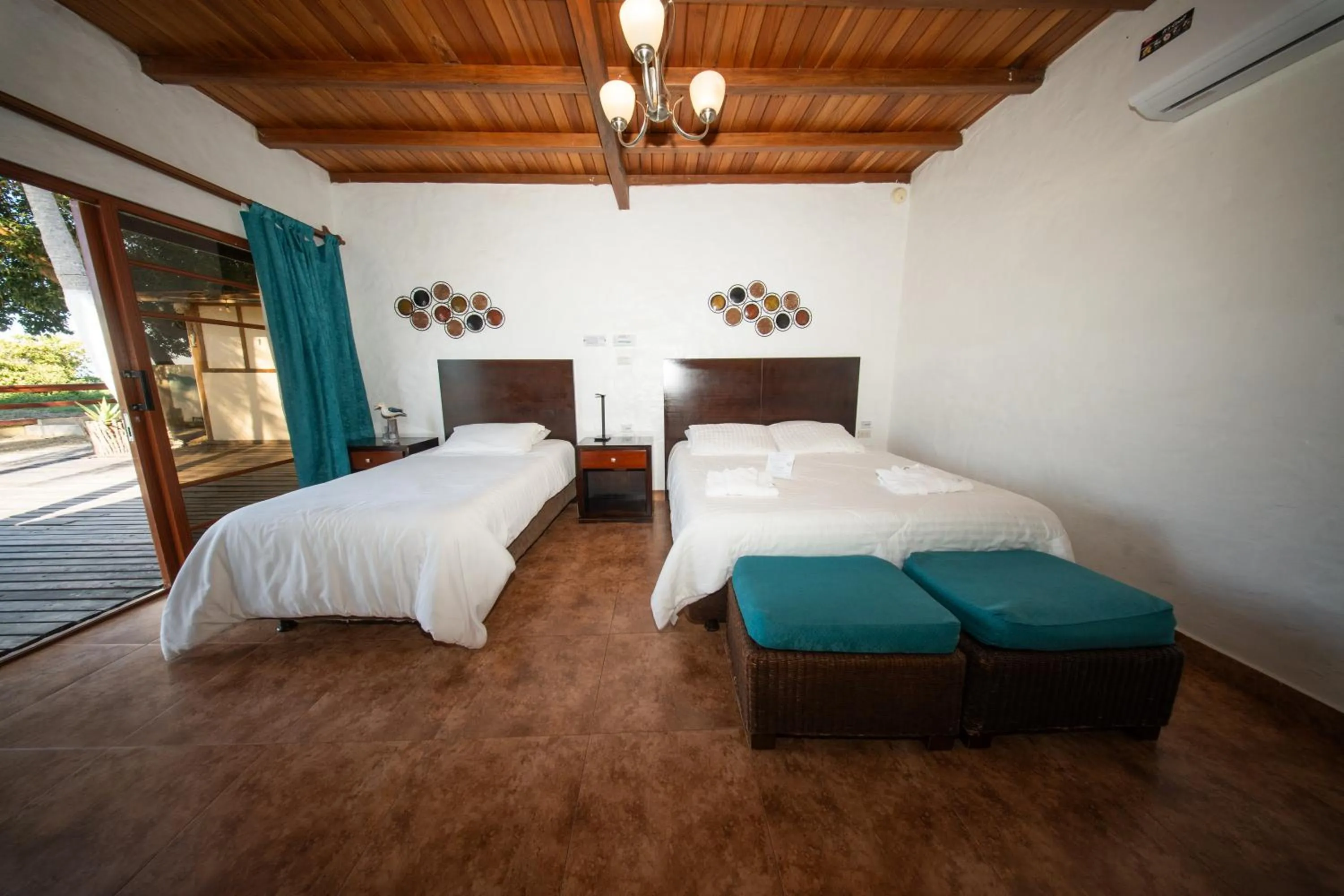 Bed in Hotel Isamar Galapagos Beachfront