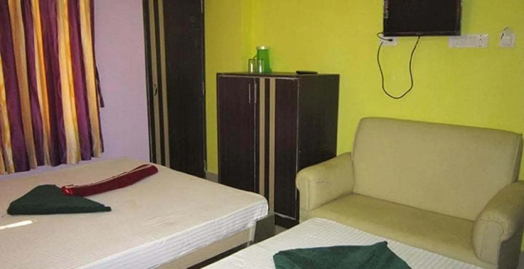 Bed in Hotel Srikrishna International