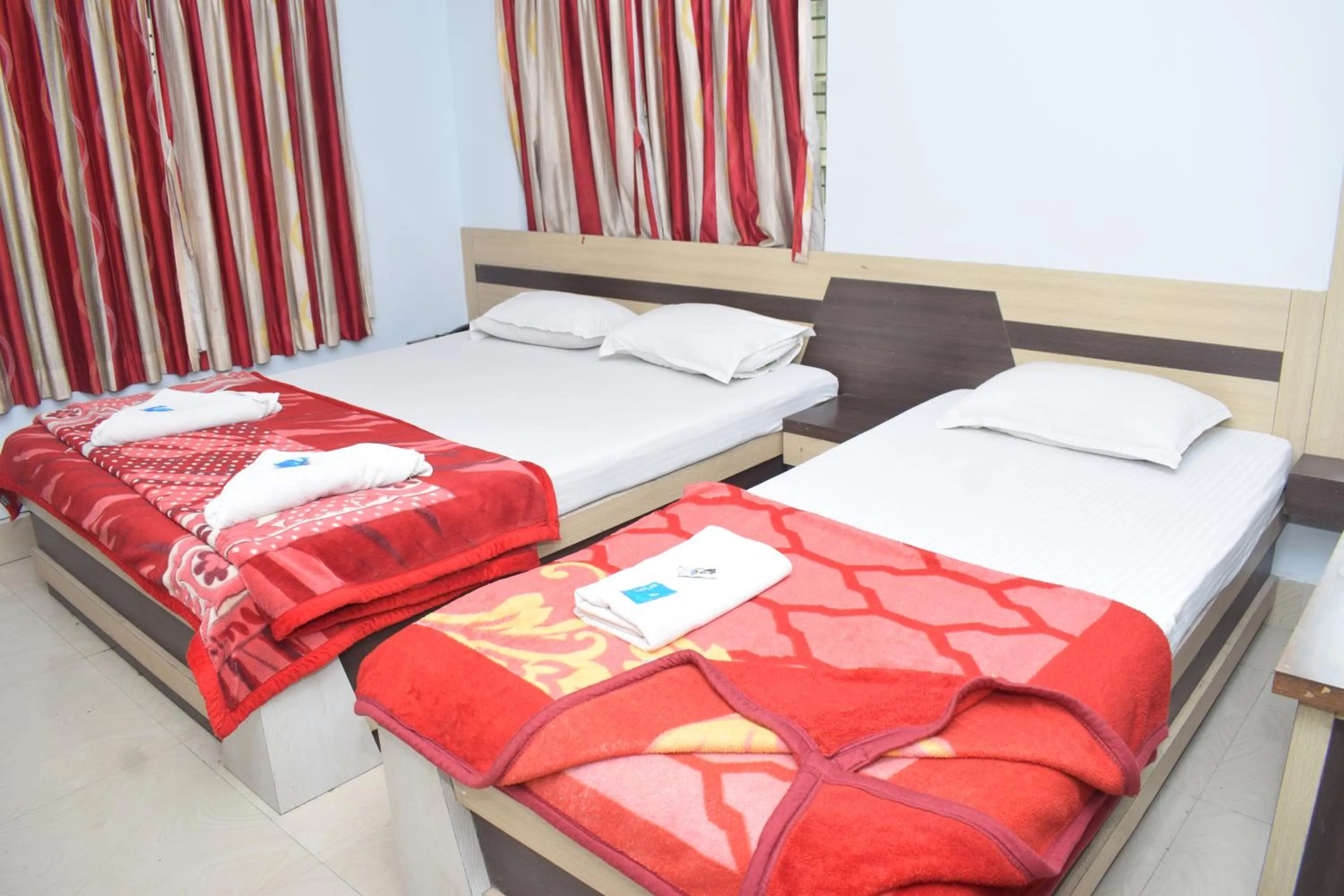 Bed in Hotel Srikrishna International