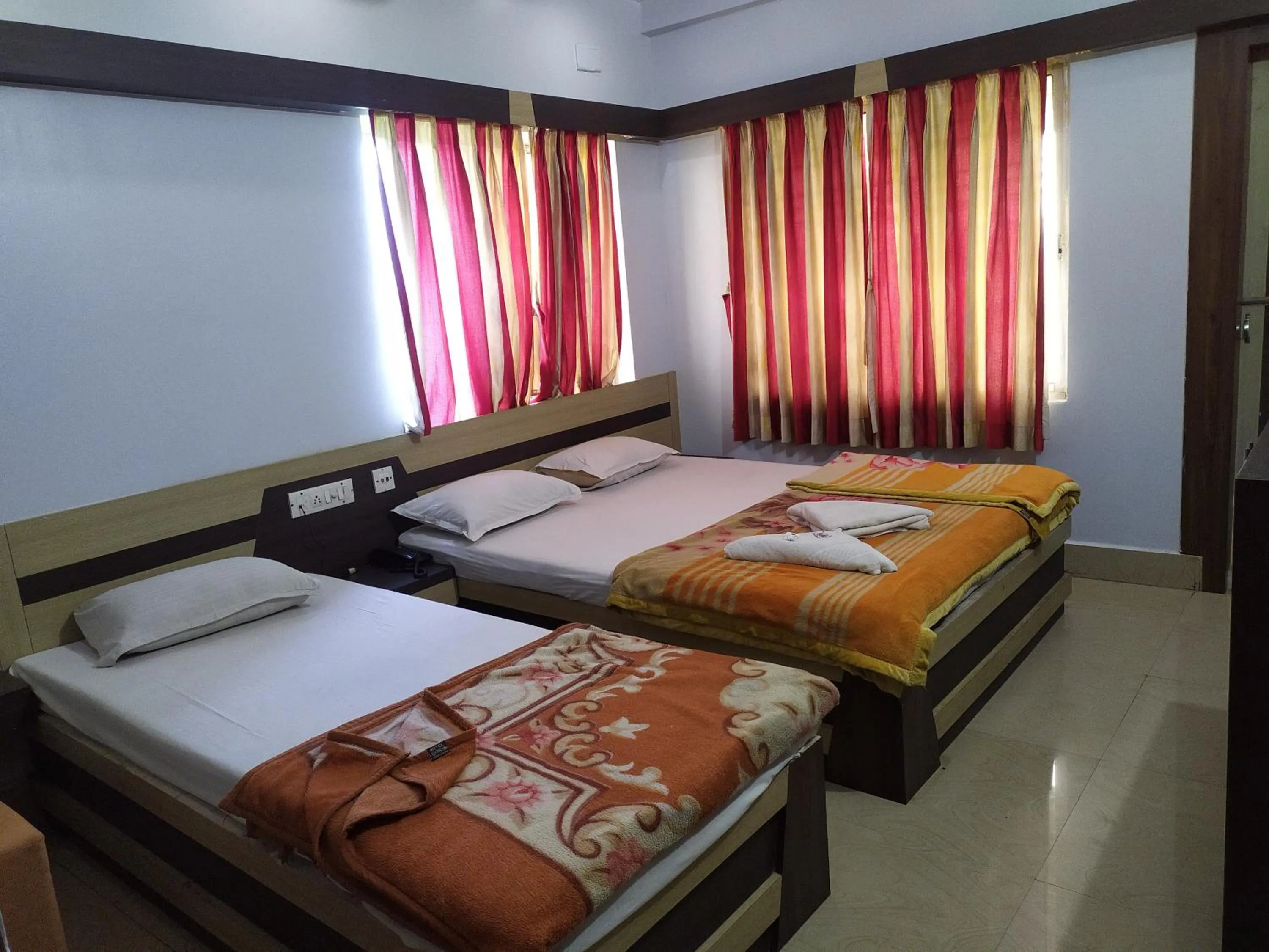 Bed in Hotel Srikrishna International