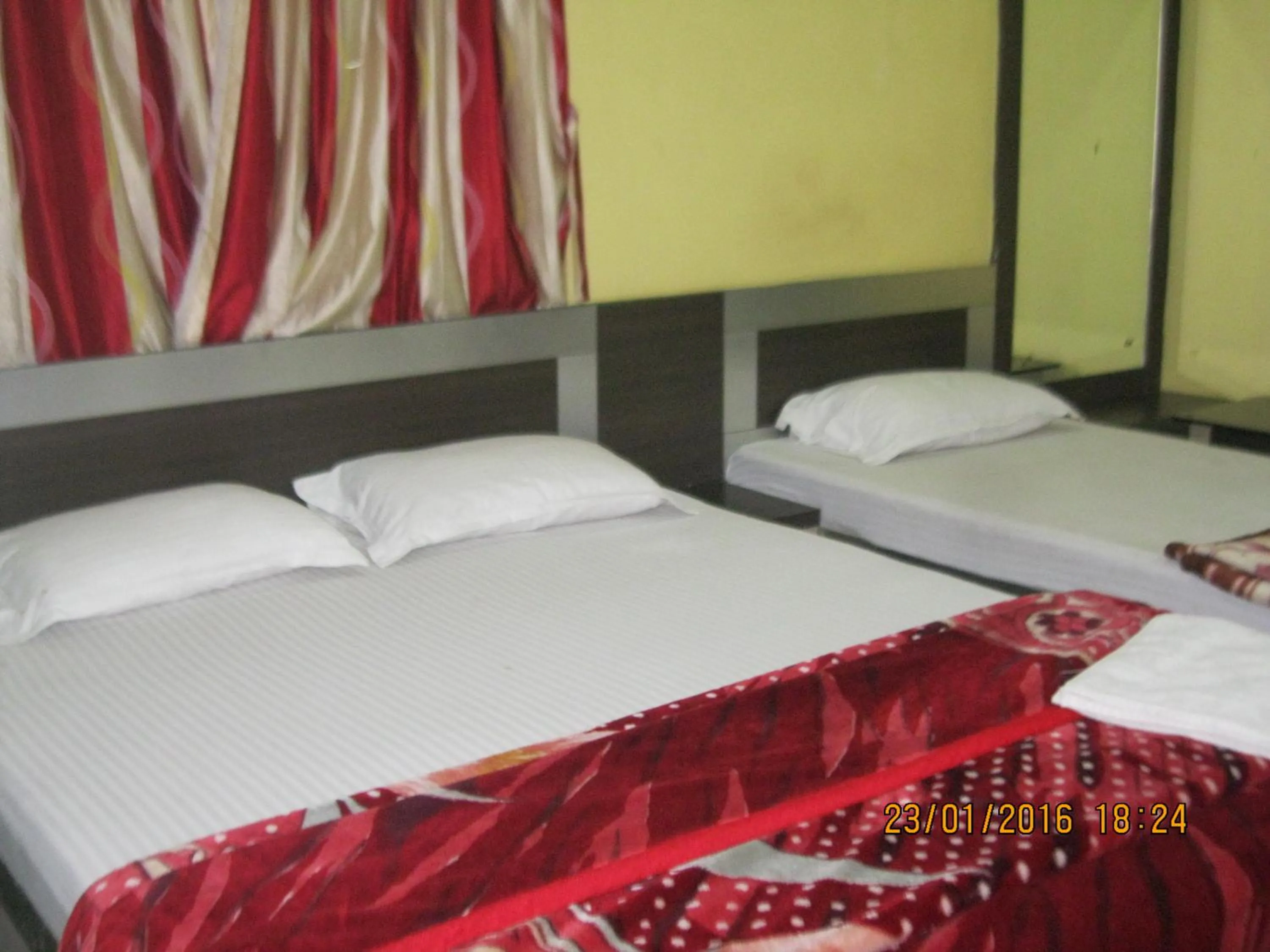 Bed in Hotel Srikrishna International
