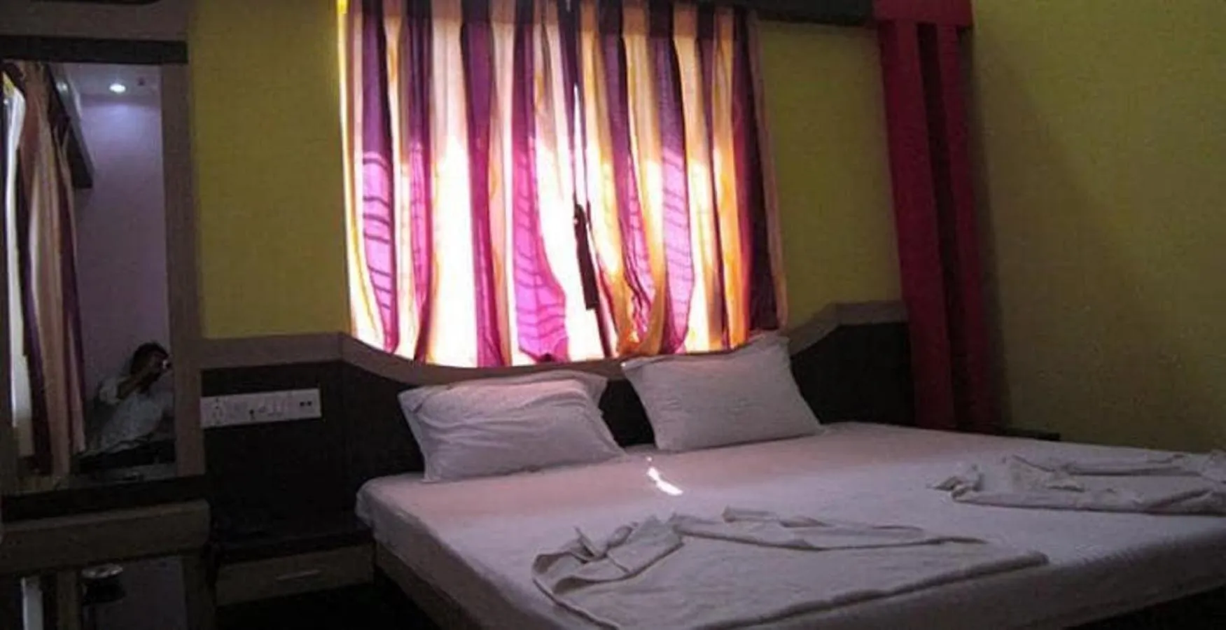 Bed in Hotel Srikrishna International