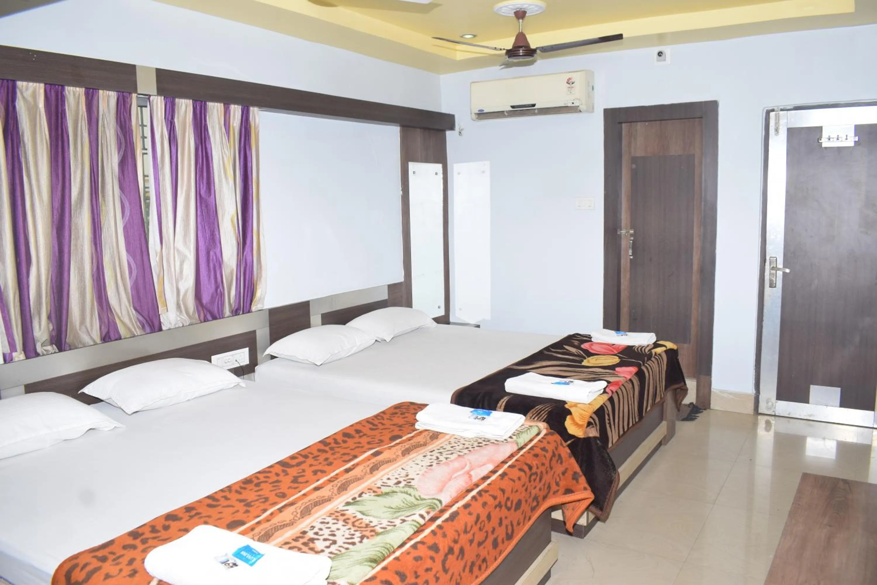 Bed in Hotel Srikrishna International
