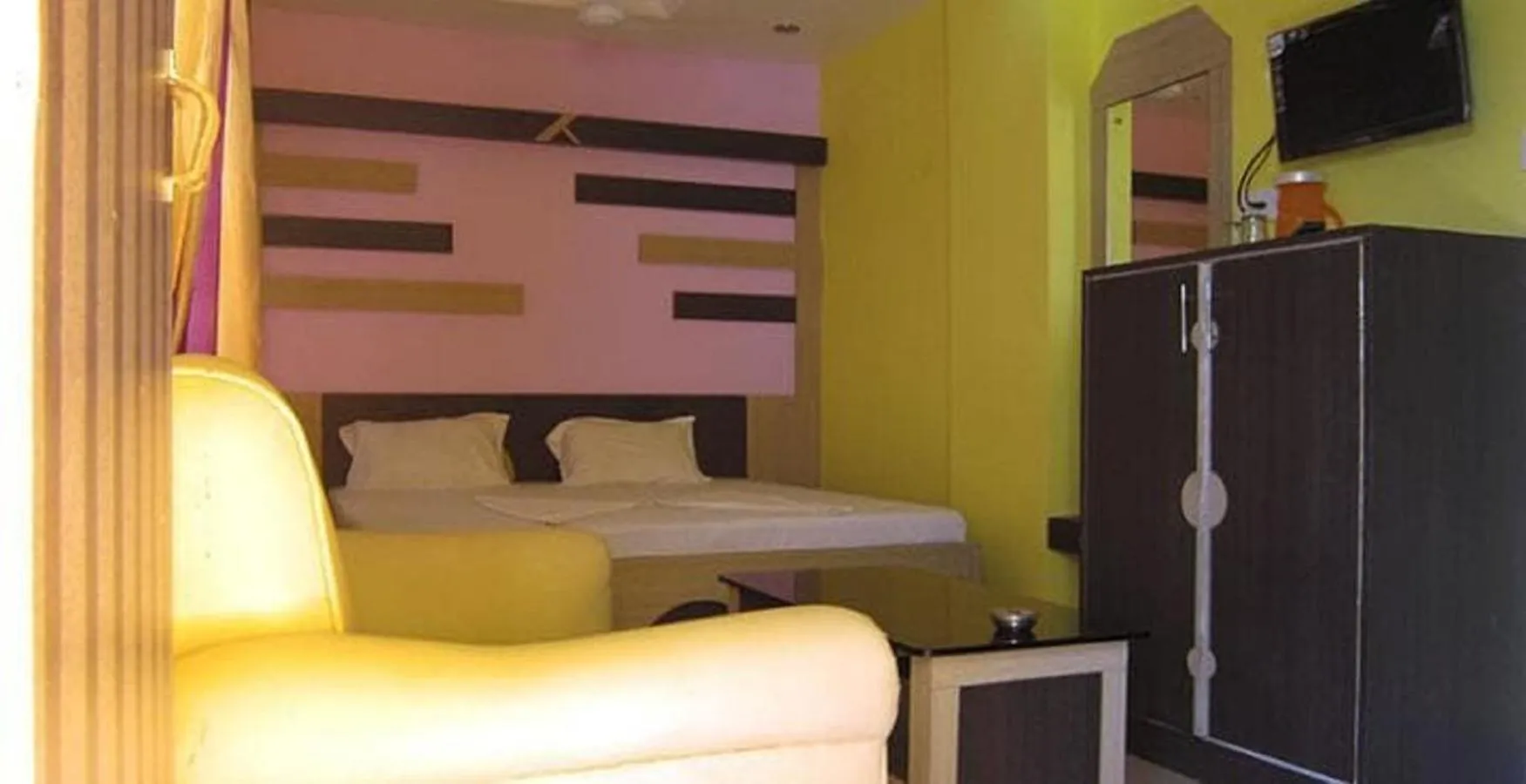 Bed in Hotel Srikrishna International