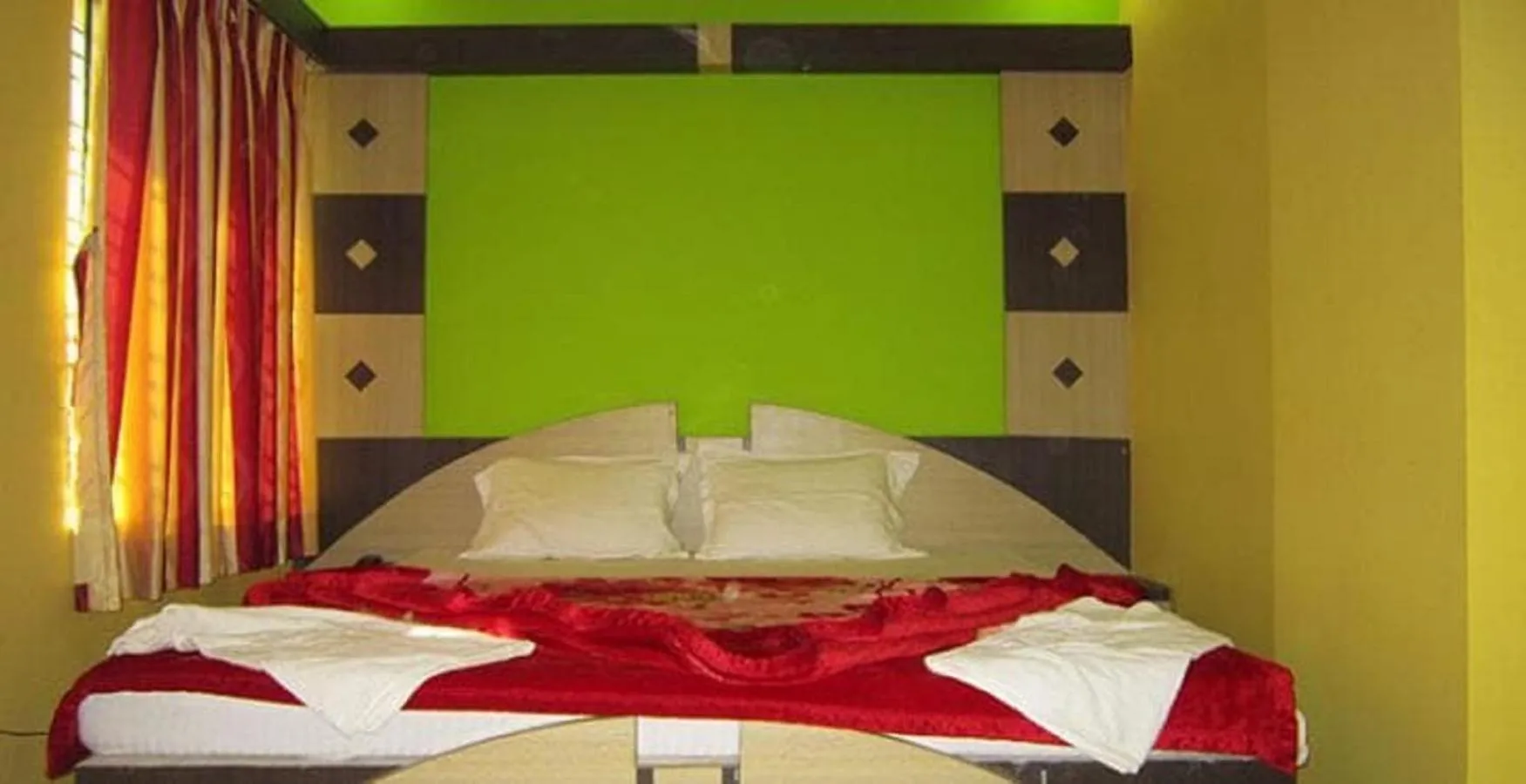 Bed in Hotel Srikrishna International
