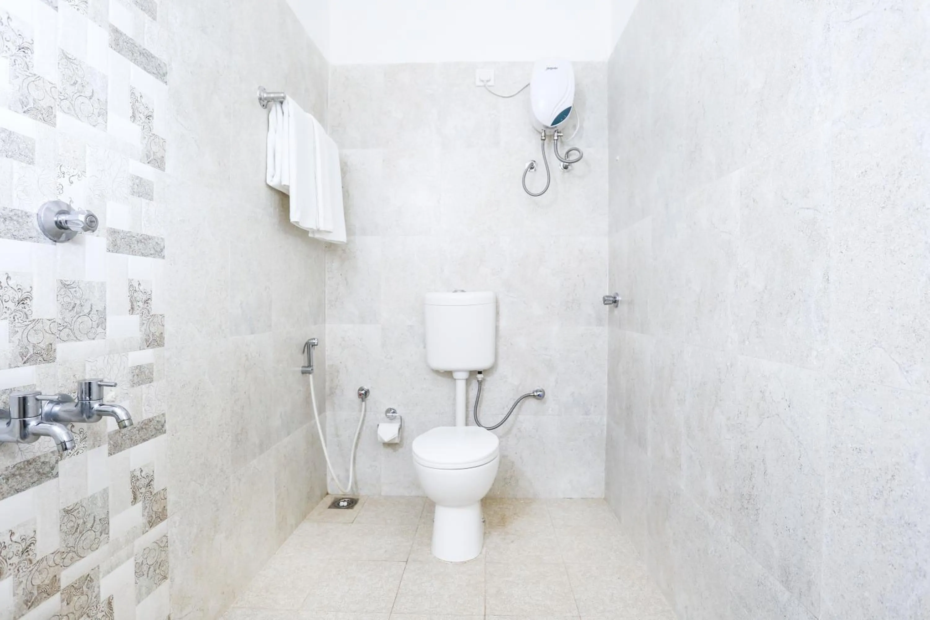 Bathroom in Treebo Comforts Inn, University Road Deralakatte