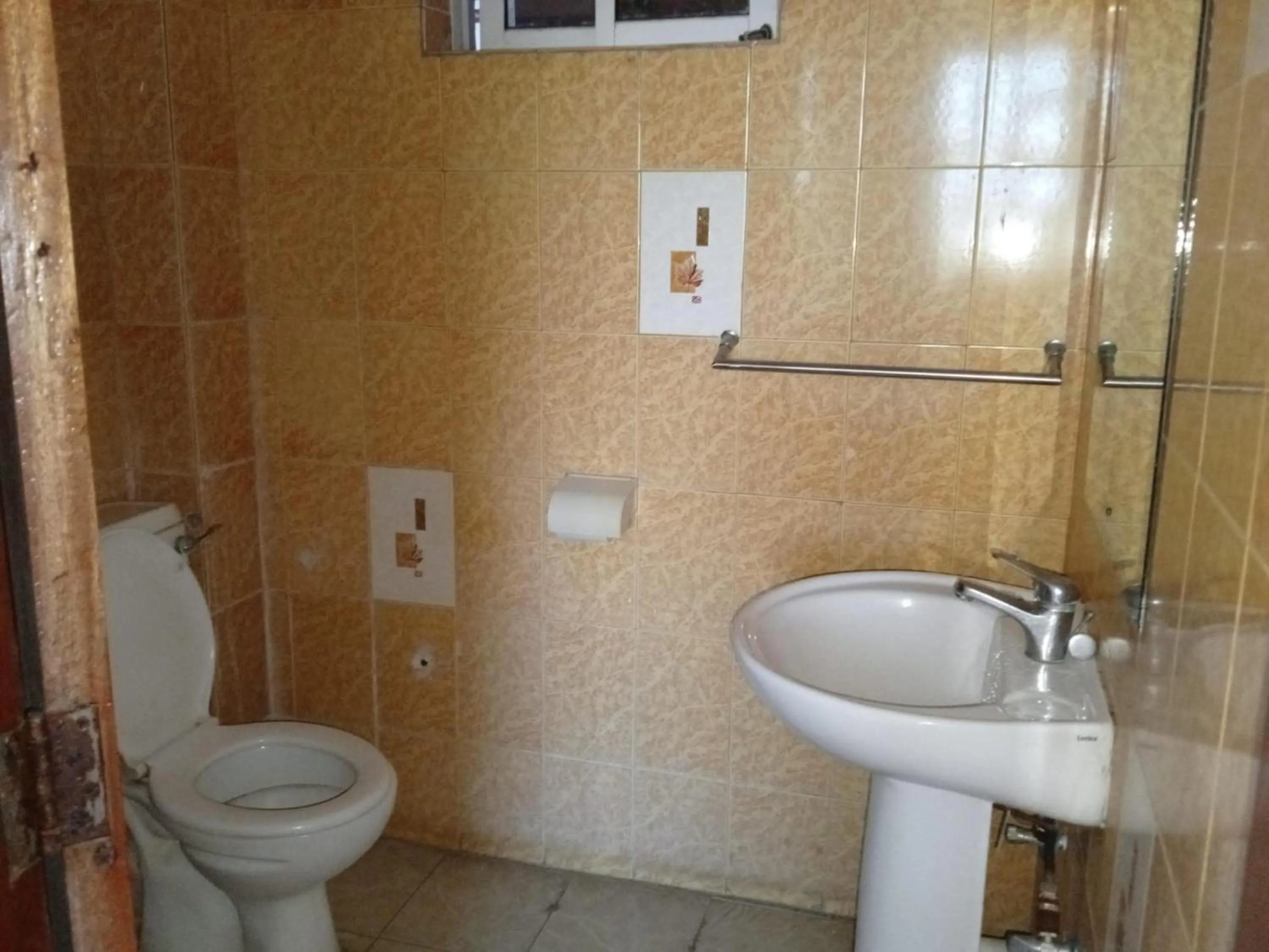 Toilet in Checkpoint Inn Hotel, Mombasa