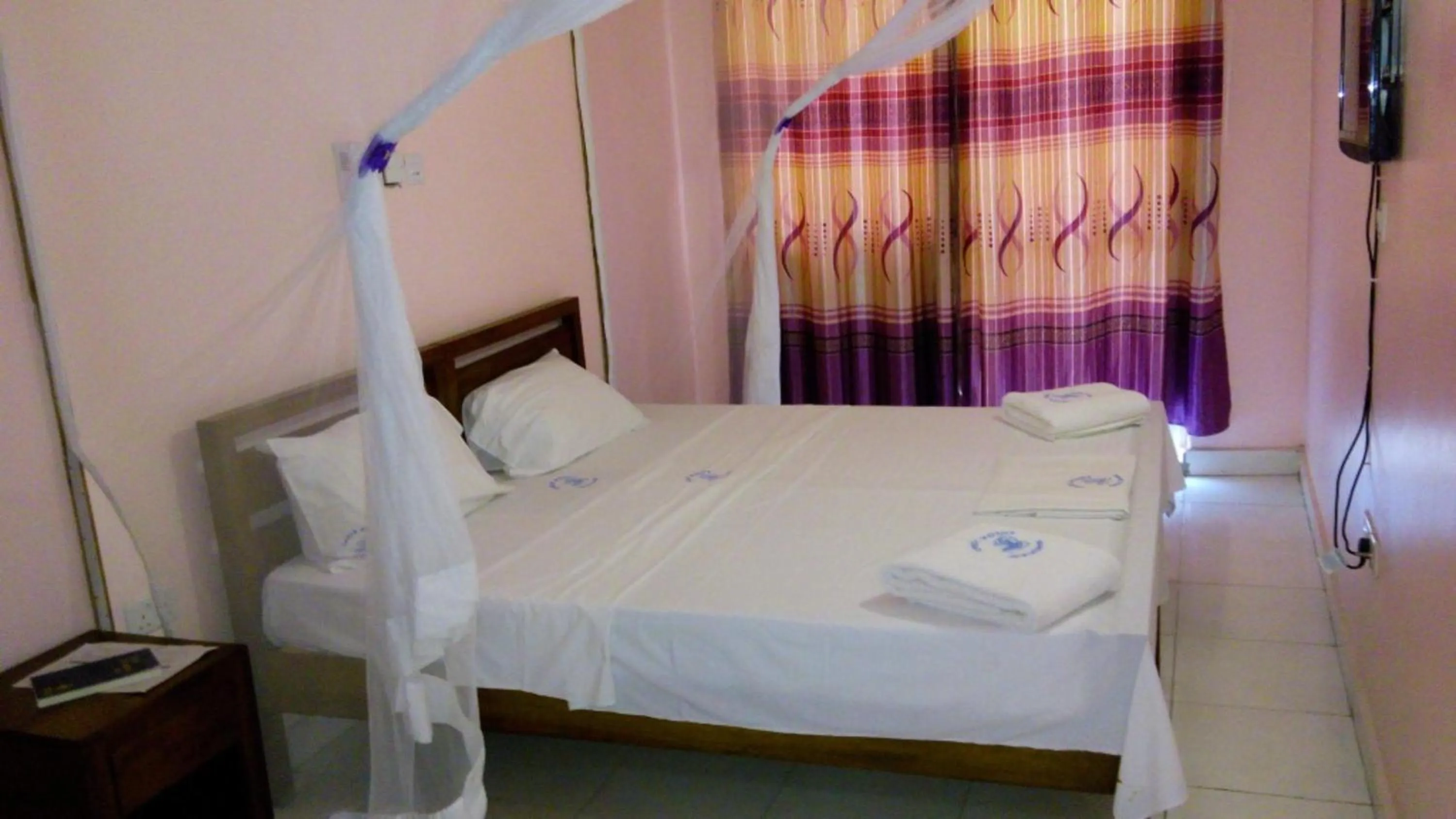 Bed in Checkpoint Inn Hotel, Mombasa