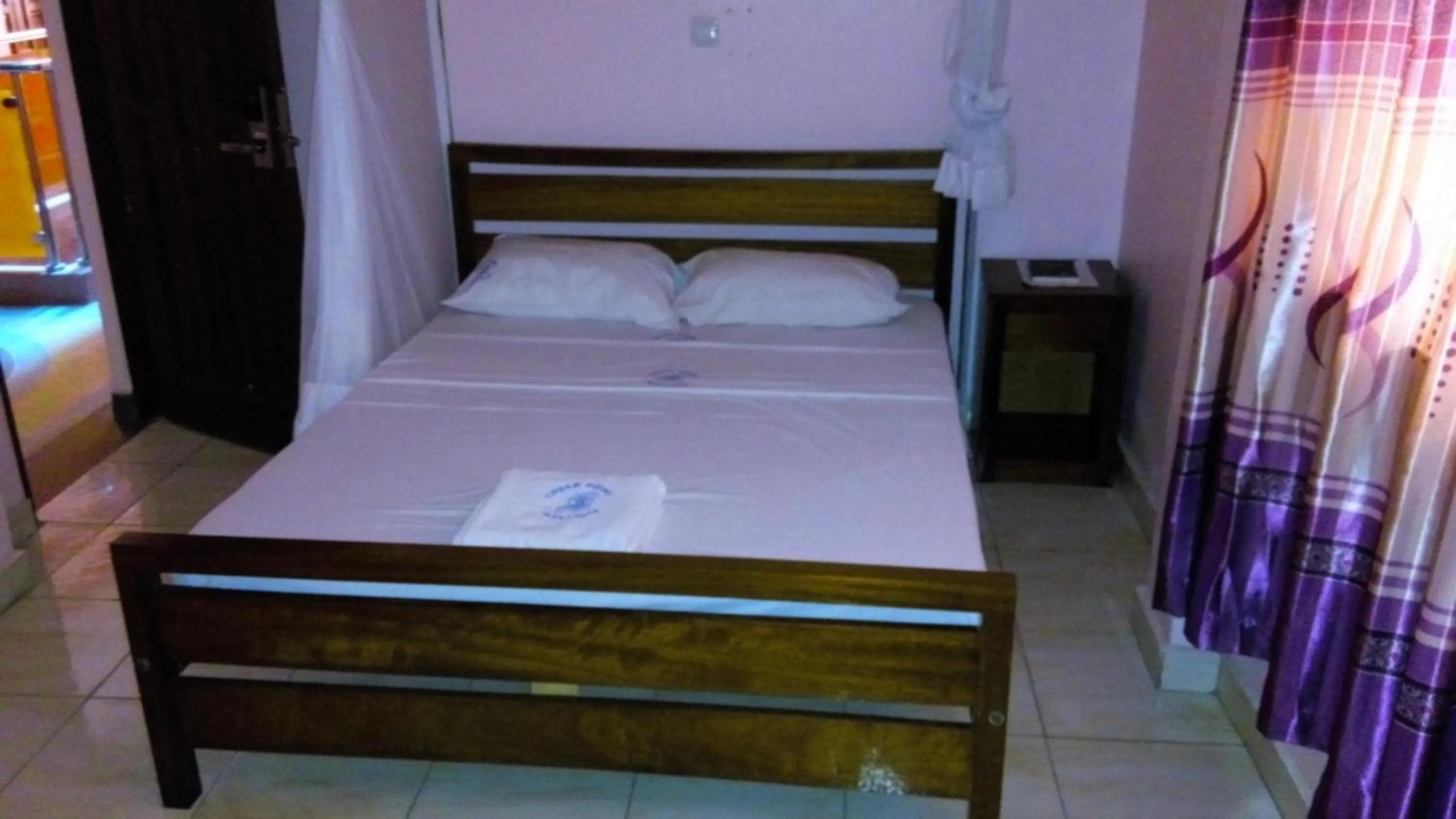 Bed in Checkpoint Inn Hotel, Mombasa
