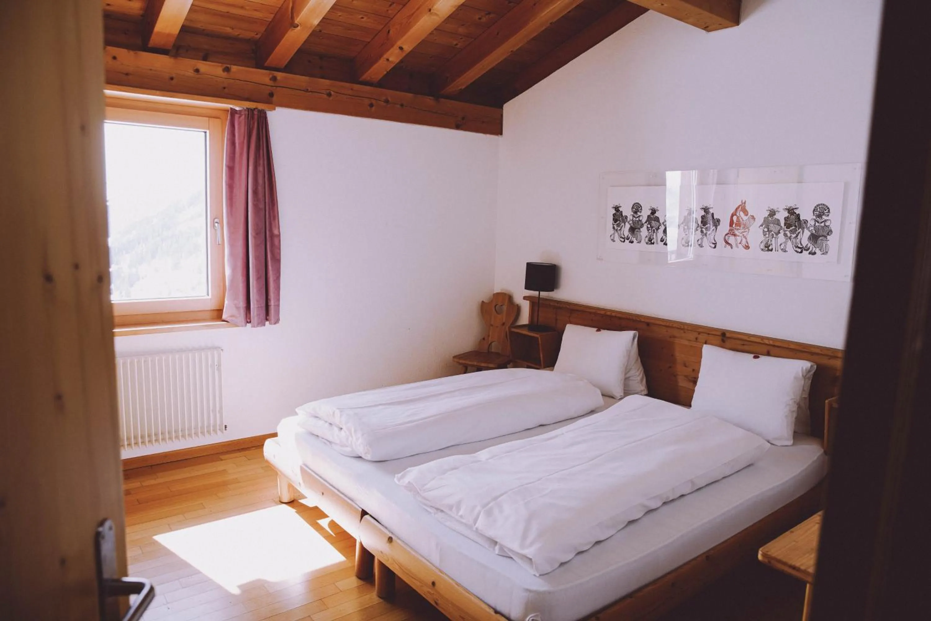 Photo of the whole room, Bed in Berghaus Sulzfluh