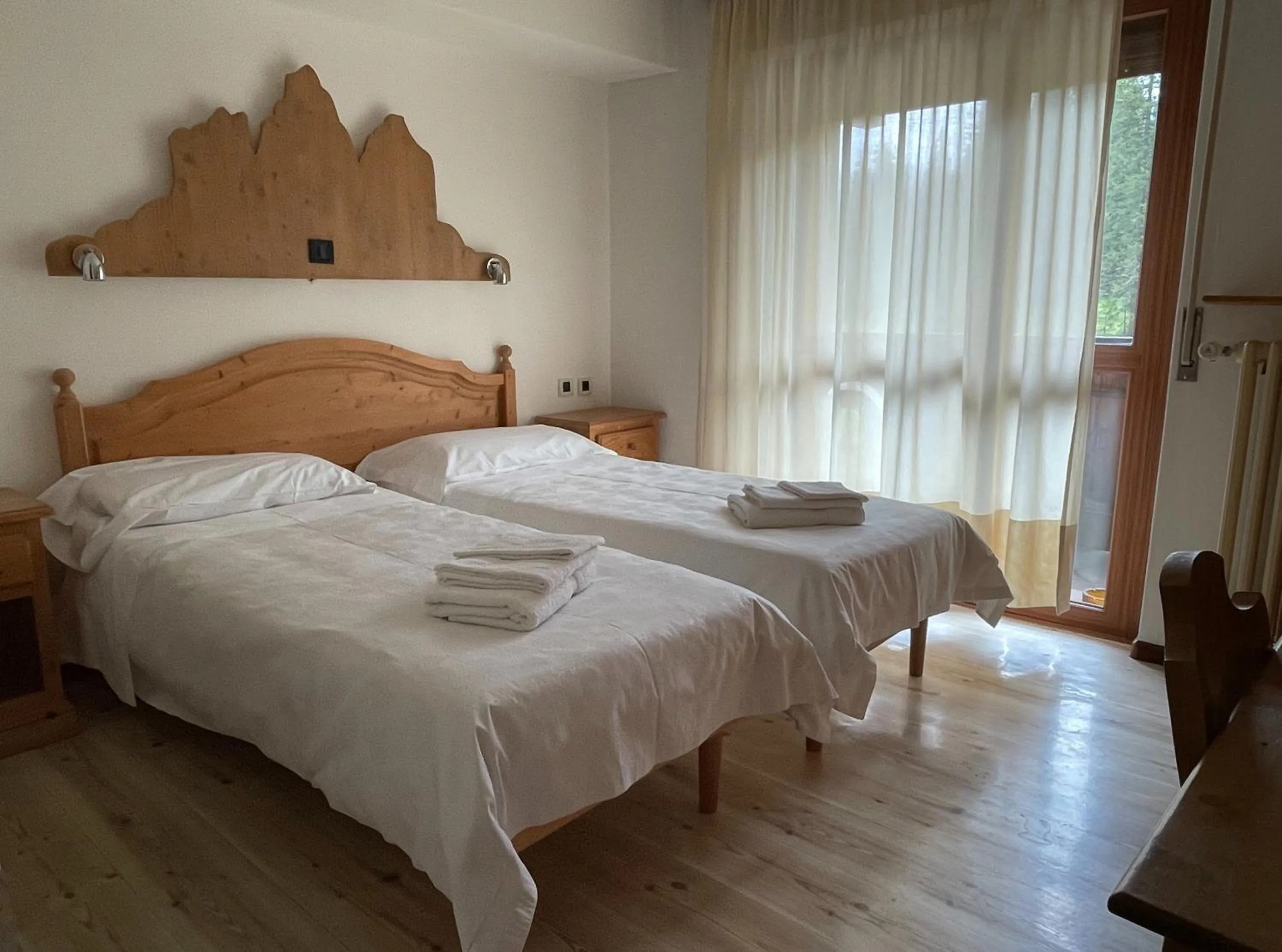 Bed in Hotel Dolomiti Des Alpes