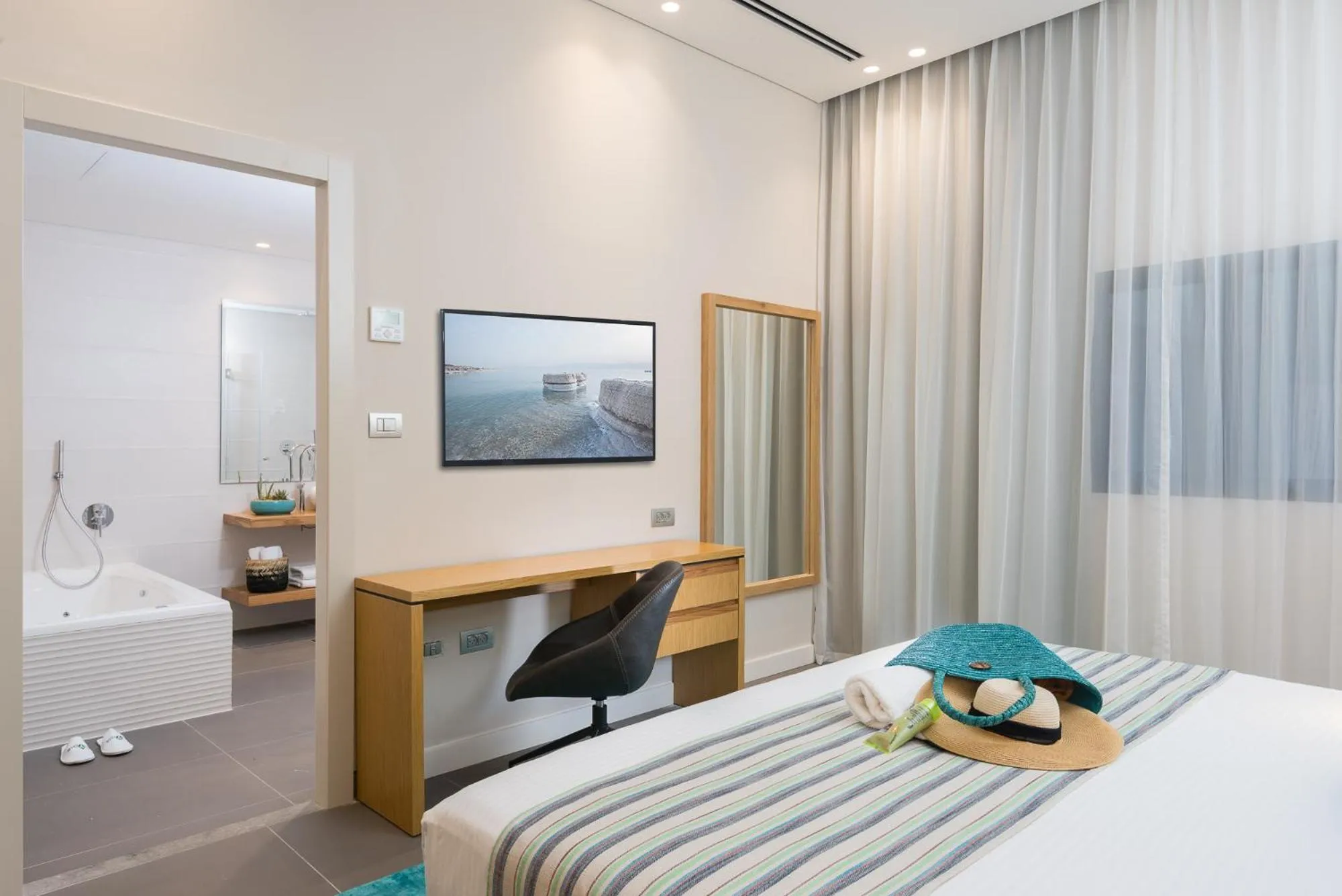 Bedroom, Bed in Oasis Spa Club Dead Sea Hotel - 18 years Plus