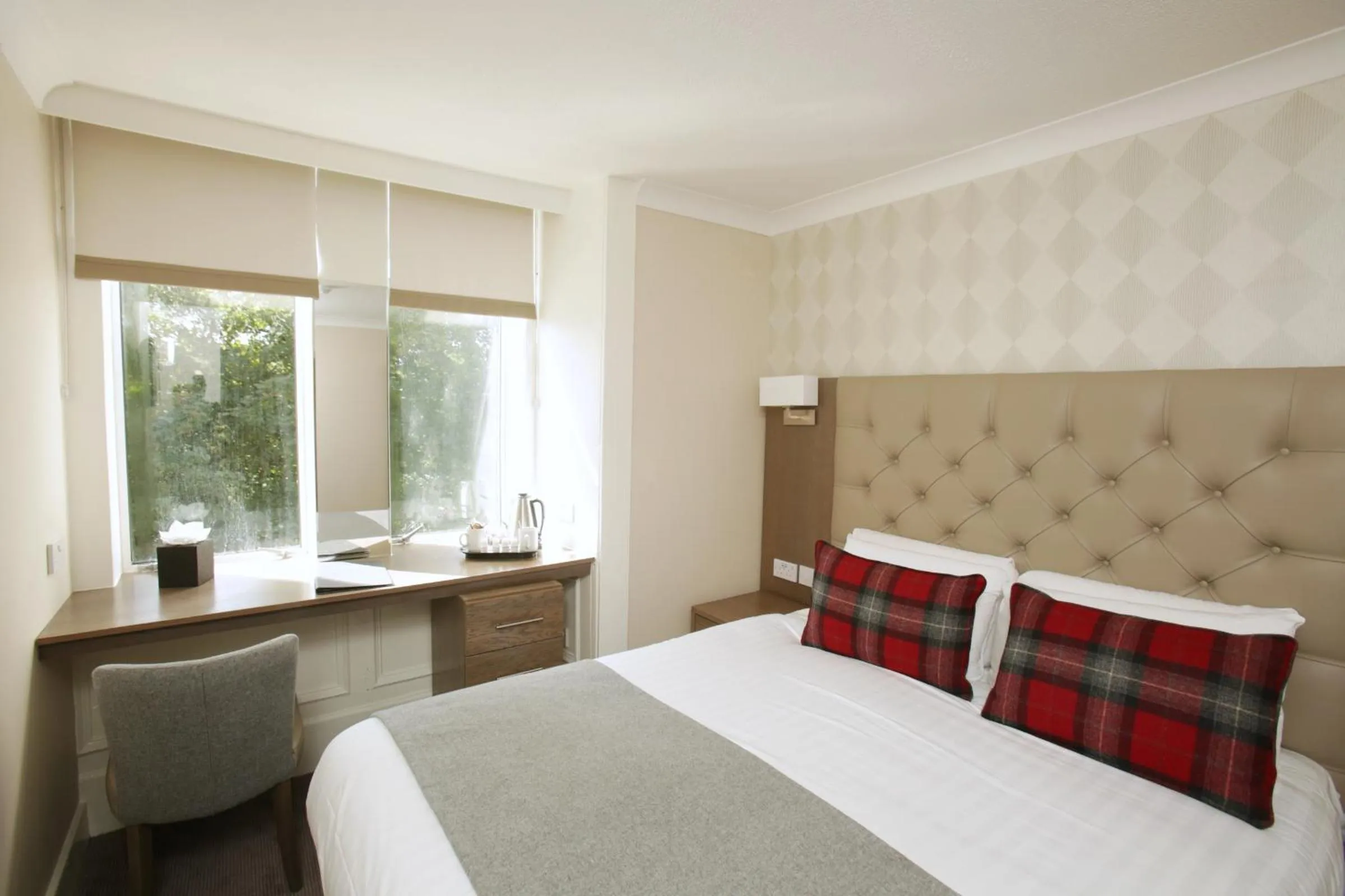 Bed in Ambassador Hotel