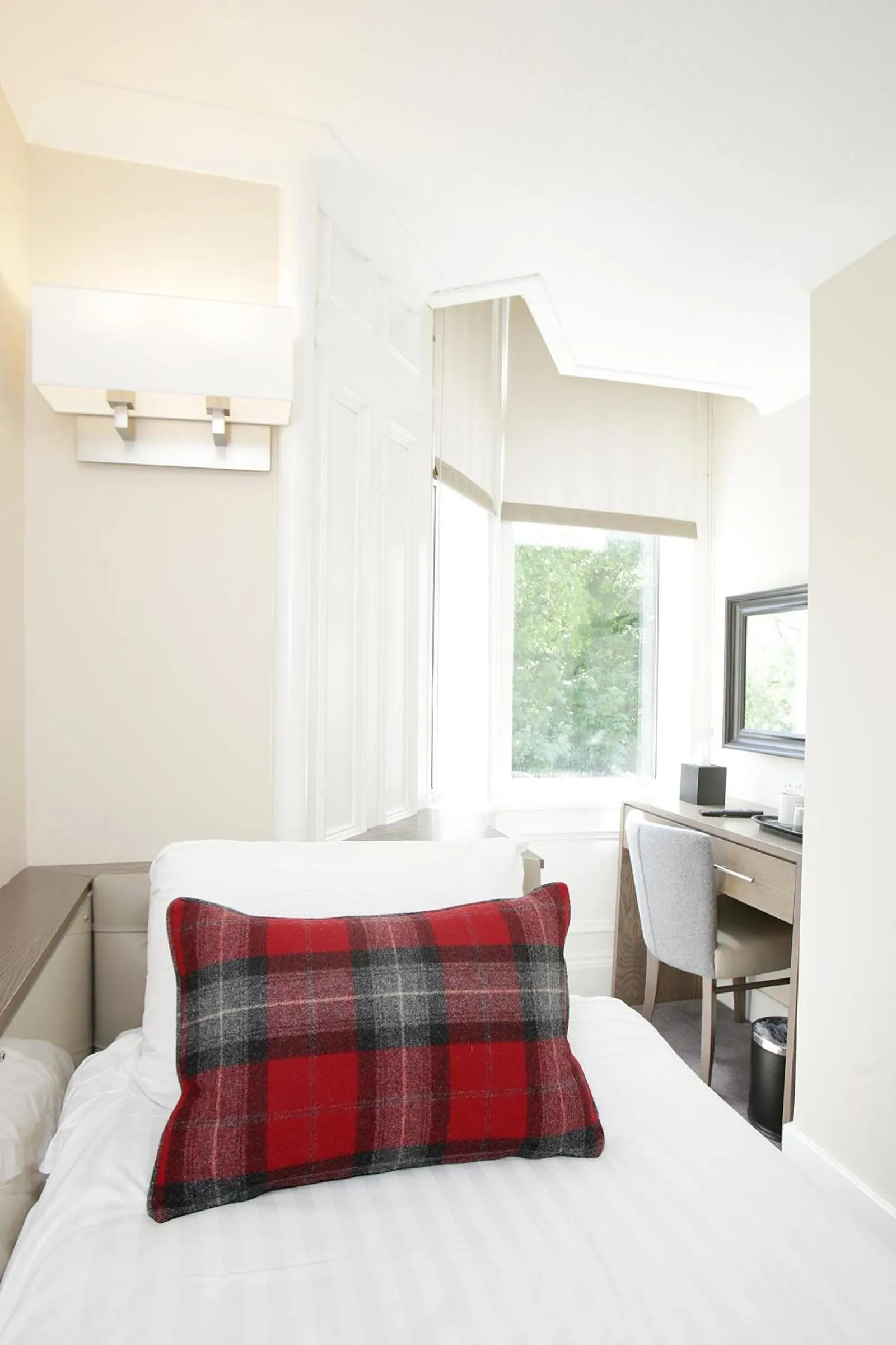 Bed in Ambassador Hotel