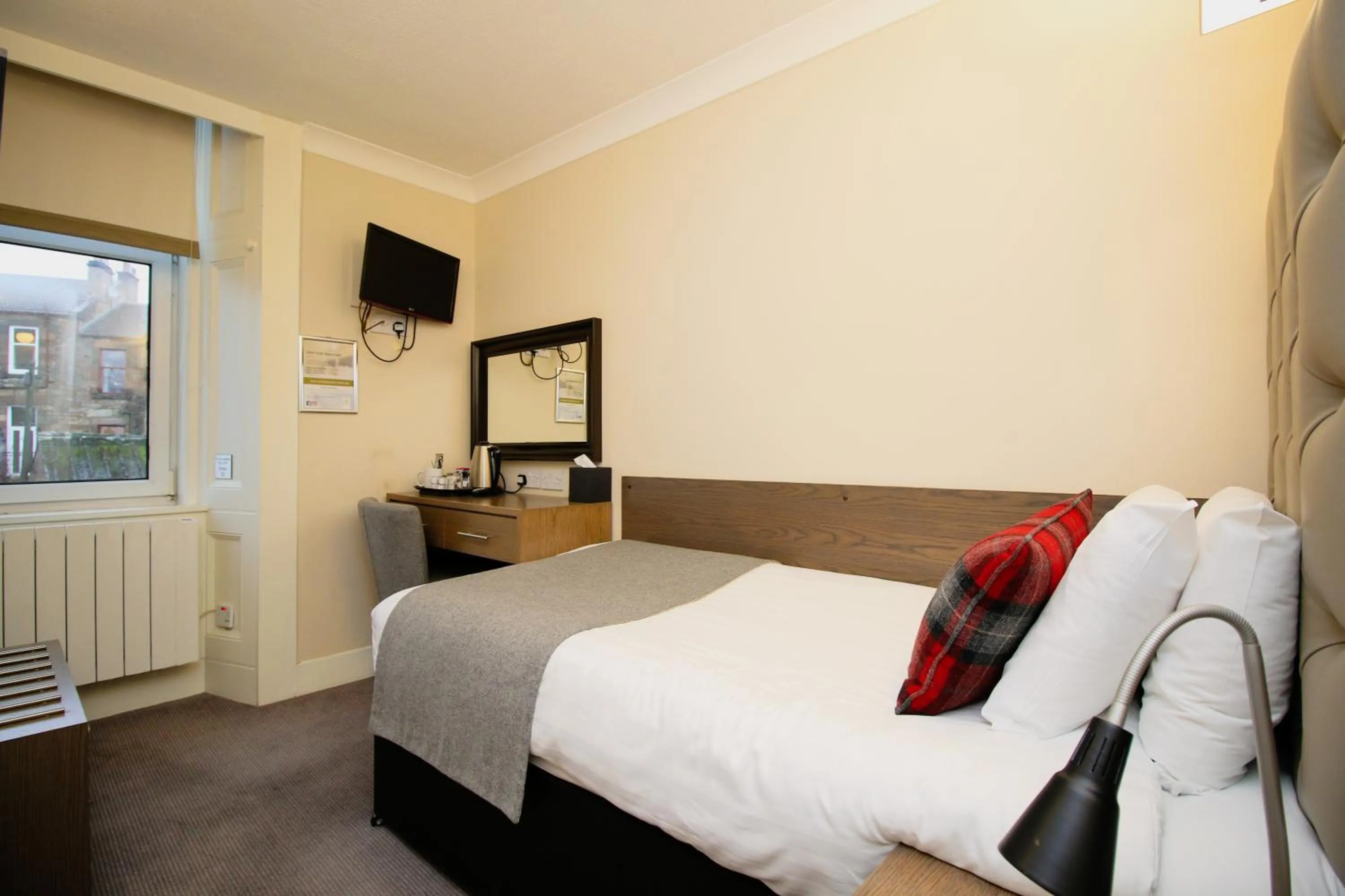 Bed in Ambassador Hotel