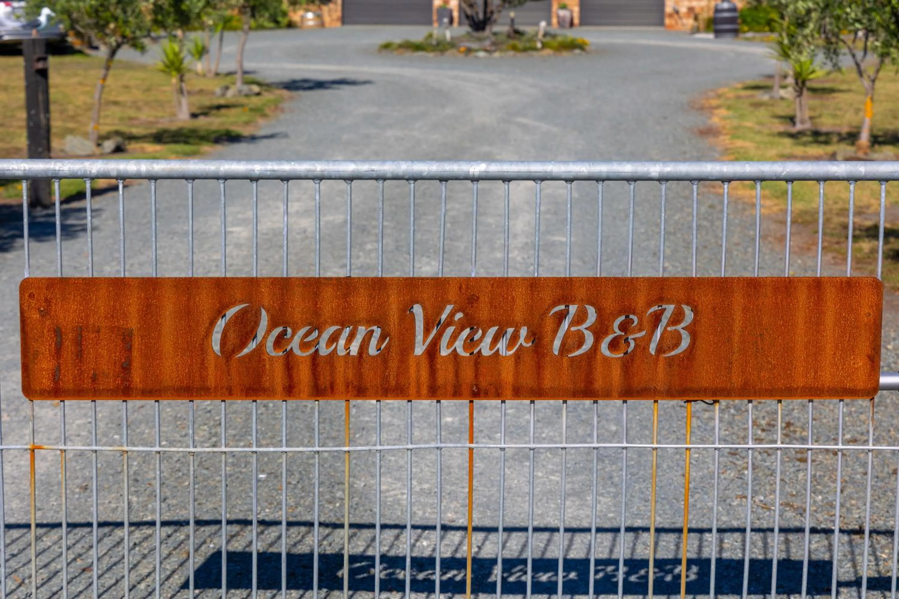 Property logo or sign in Ocean View Beachfront Apartment