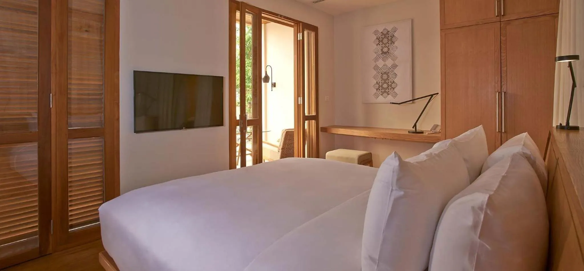 Communal lounge/ TV room, Bed in Avani+ Luang Prabang Hotel
