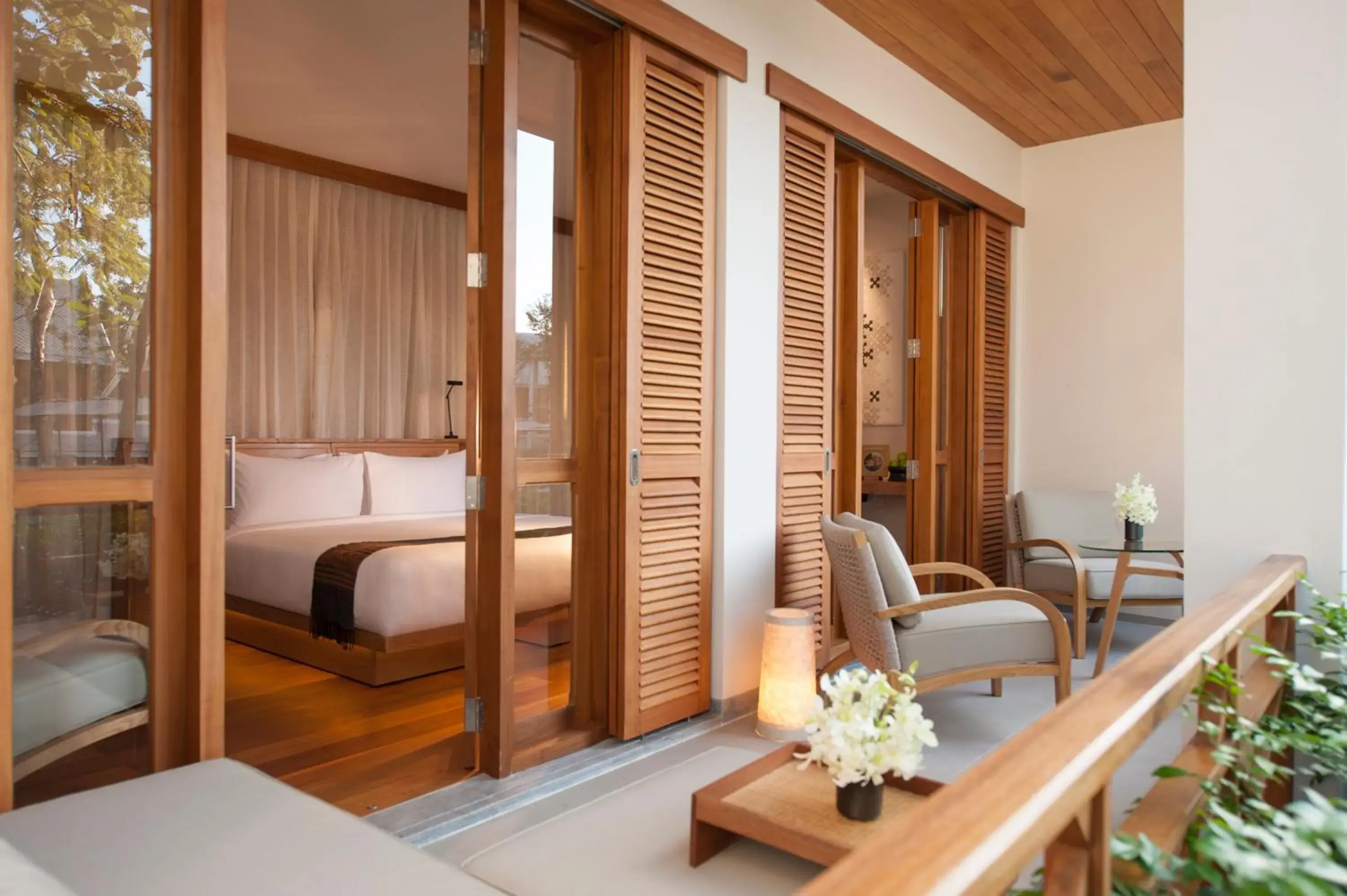 Balcony/Terrace, Bed in Avani+ Luang Prabang Hotel Balcony/Terrace, Bed in Avani+ Luang Prabang Hotel