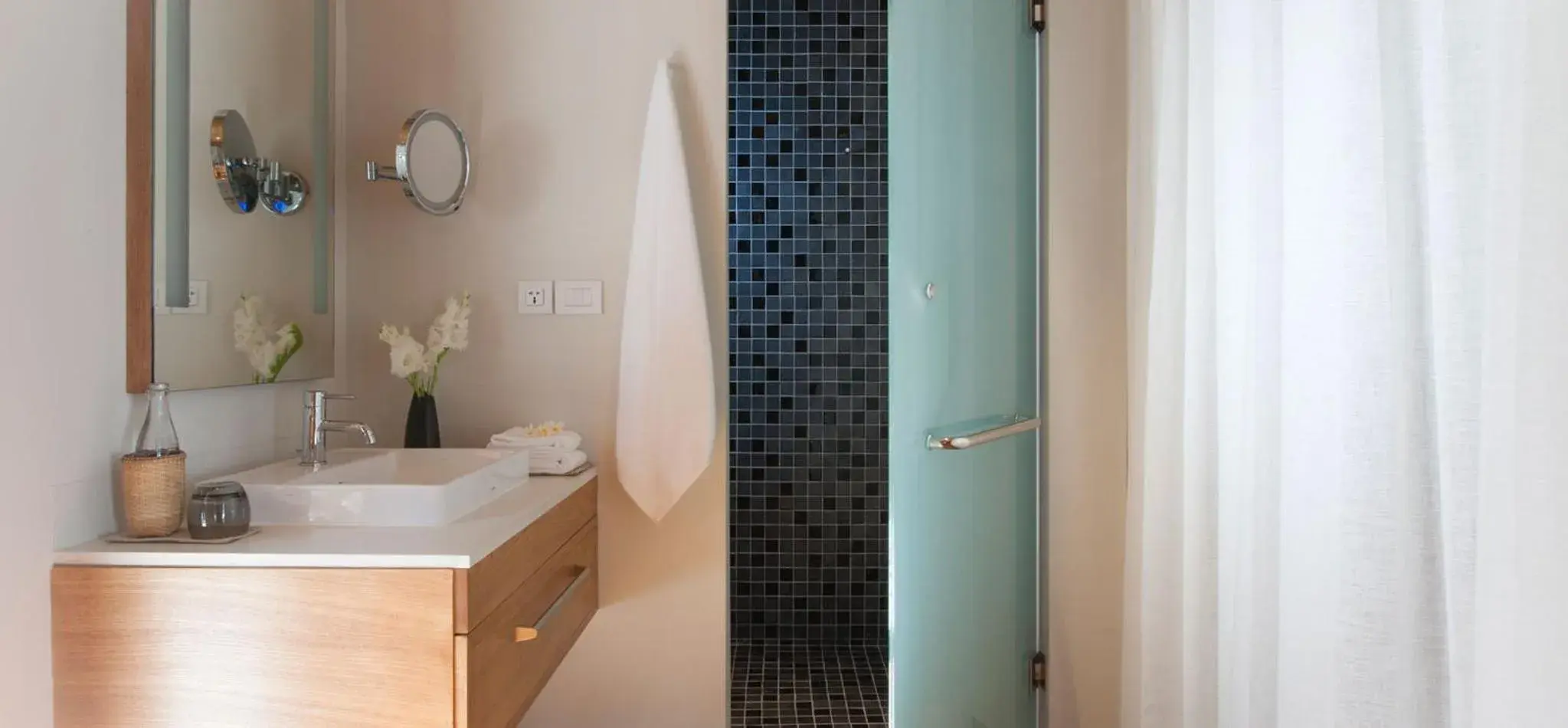 Bathroom in Avani+ Luang Prabang Hotel Bathroom in Avani+ Luang Prabang Hotel