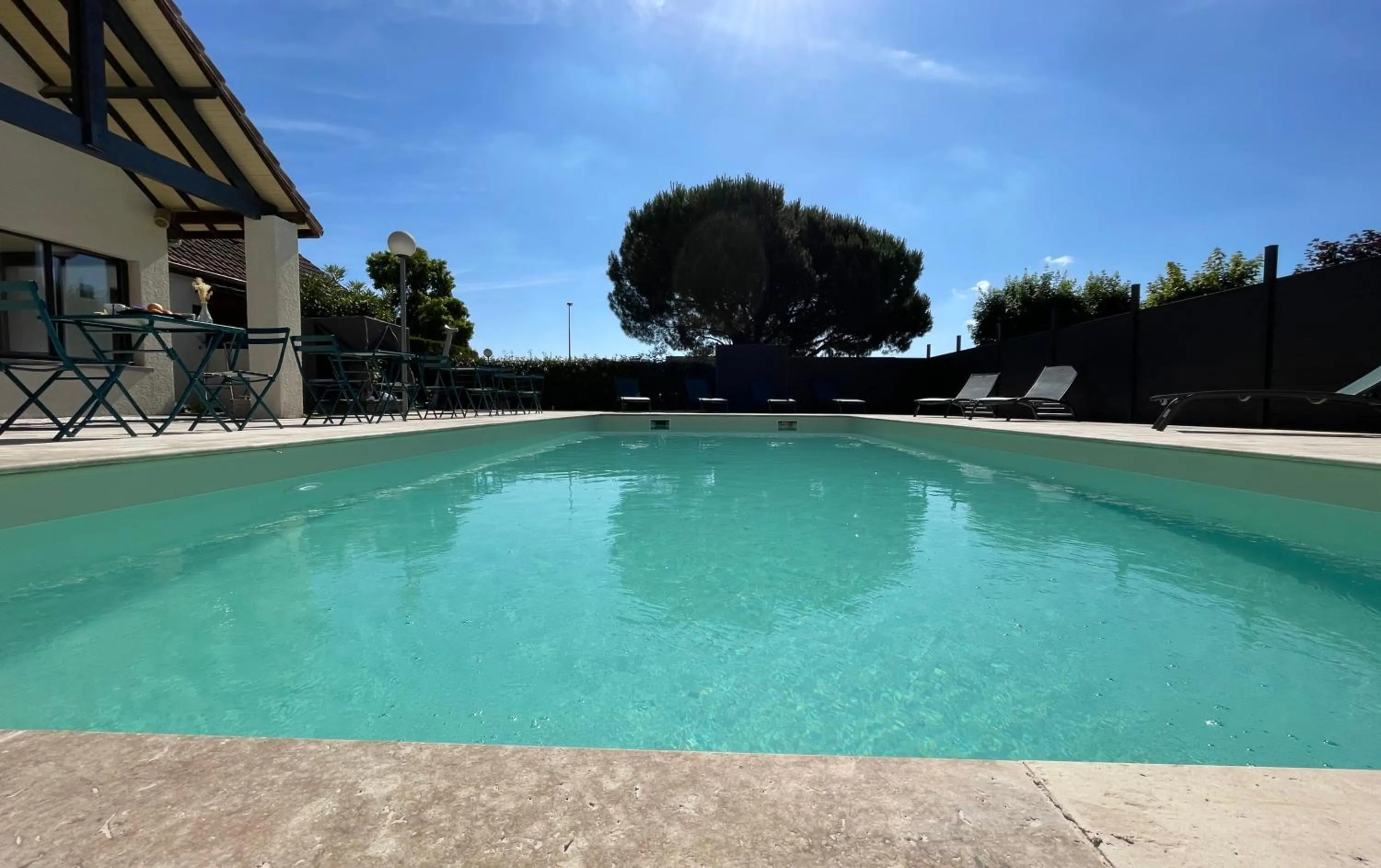 Swimming pool in Hôtel Le Roxane