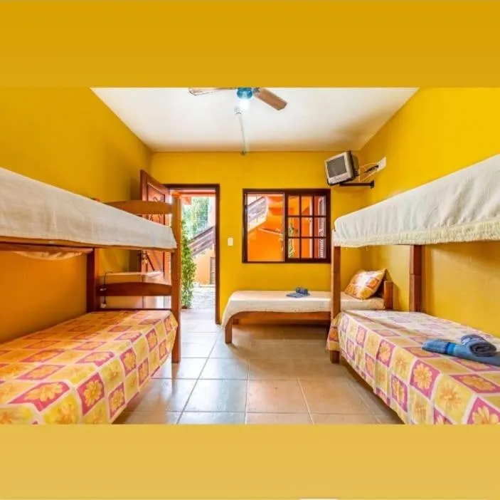 Bed in Pousada Baleia Franca