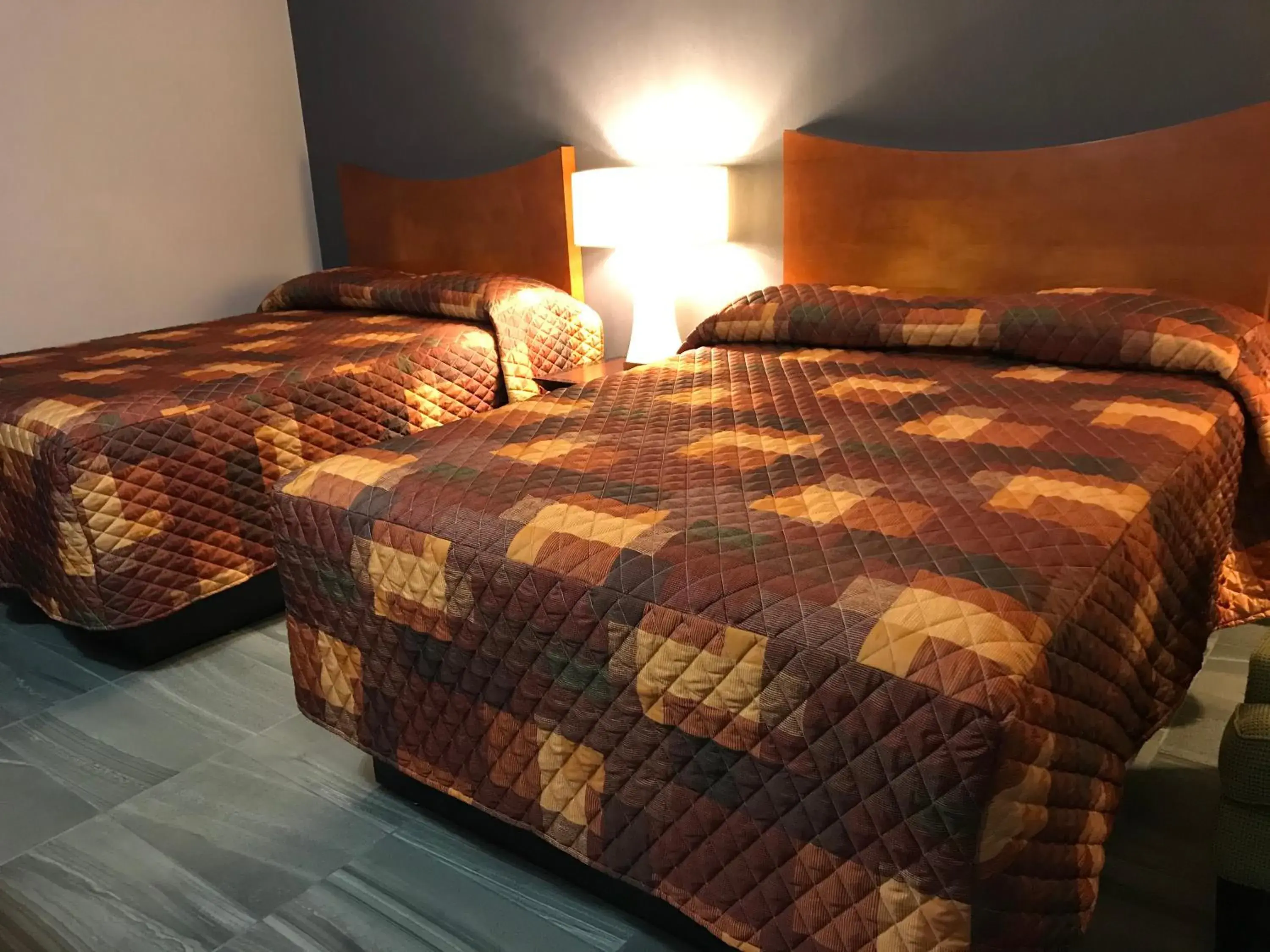 Bed in Budget Inn & Suites