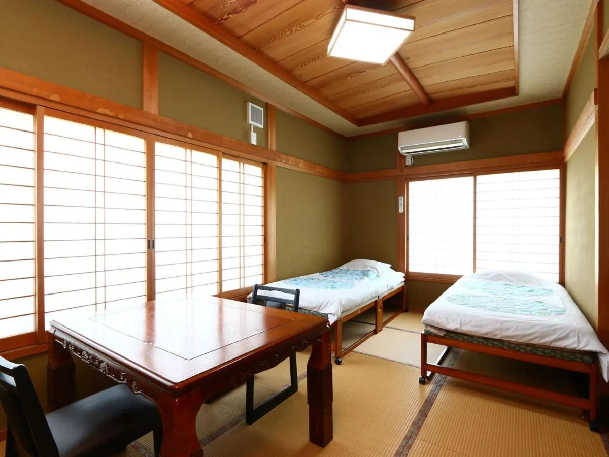 Bed in Minshuku Ryokan Kawai
