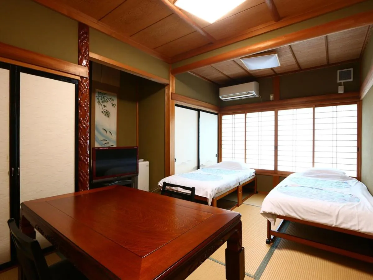 Bed in Minshuku Ryokan Kawai