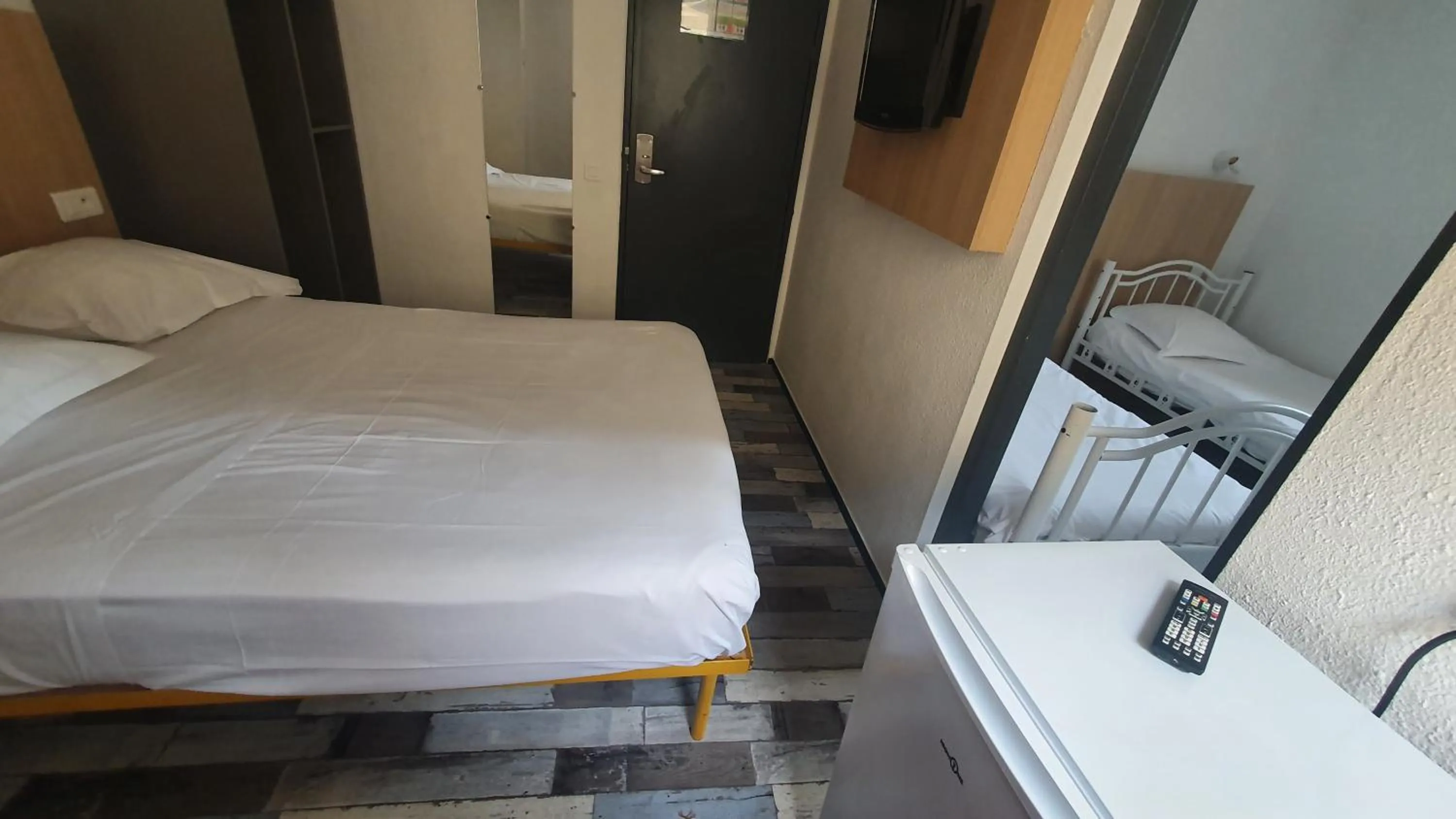 Bed in Welcomotel Limoges