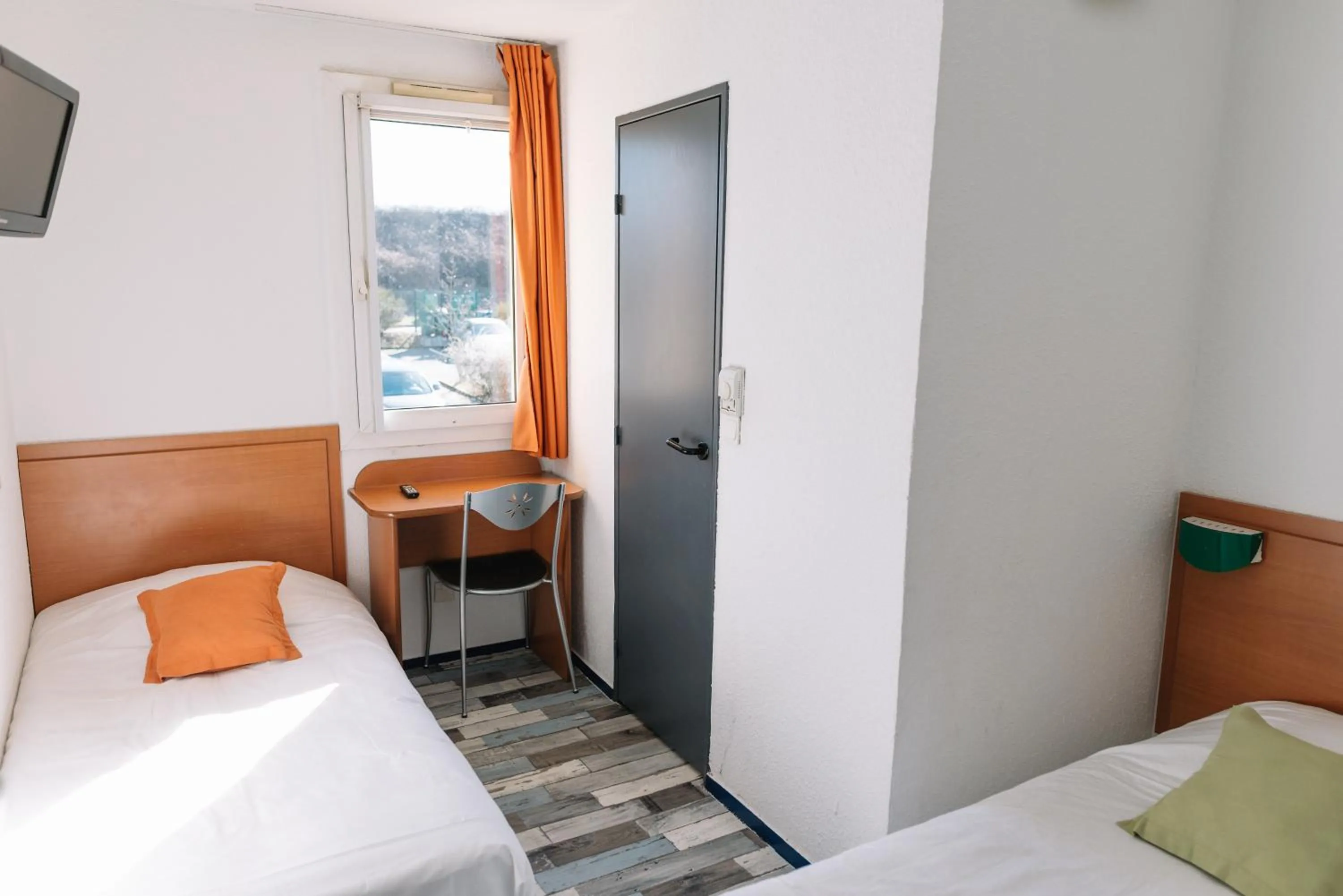 Bed in Welcomotel Limoges