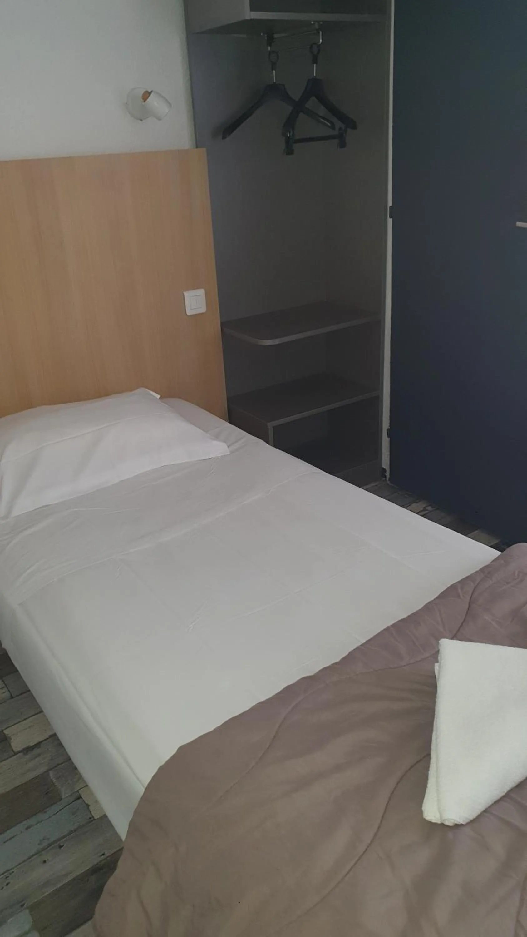 Bed in Welcomotel Limoges