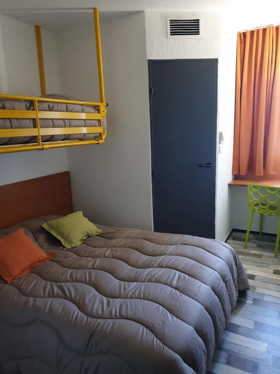 Bed in Welcomotel Limoges