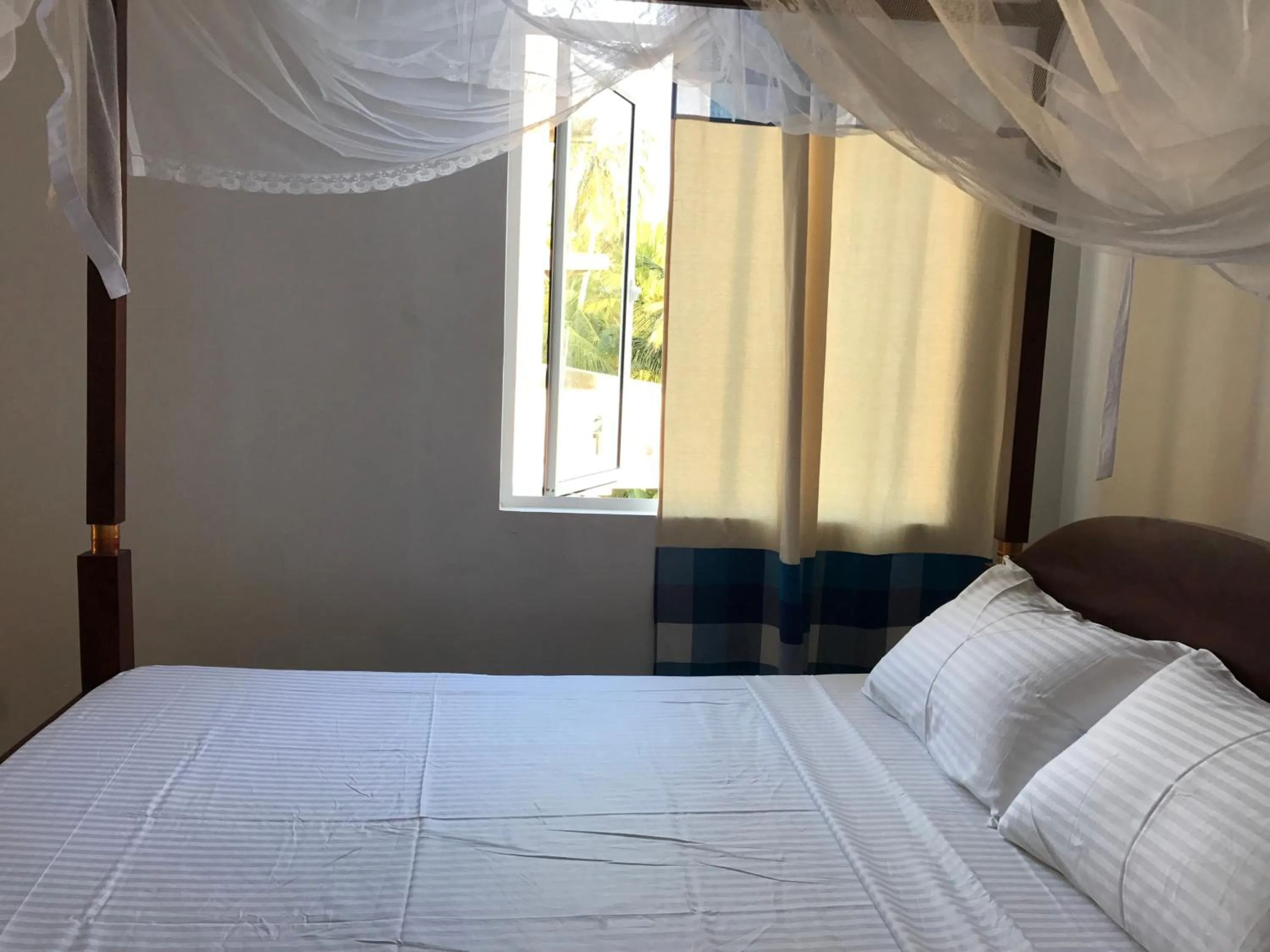 Bed in Bliss Apartment Hikkaduwa