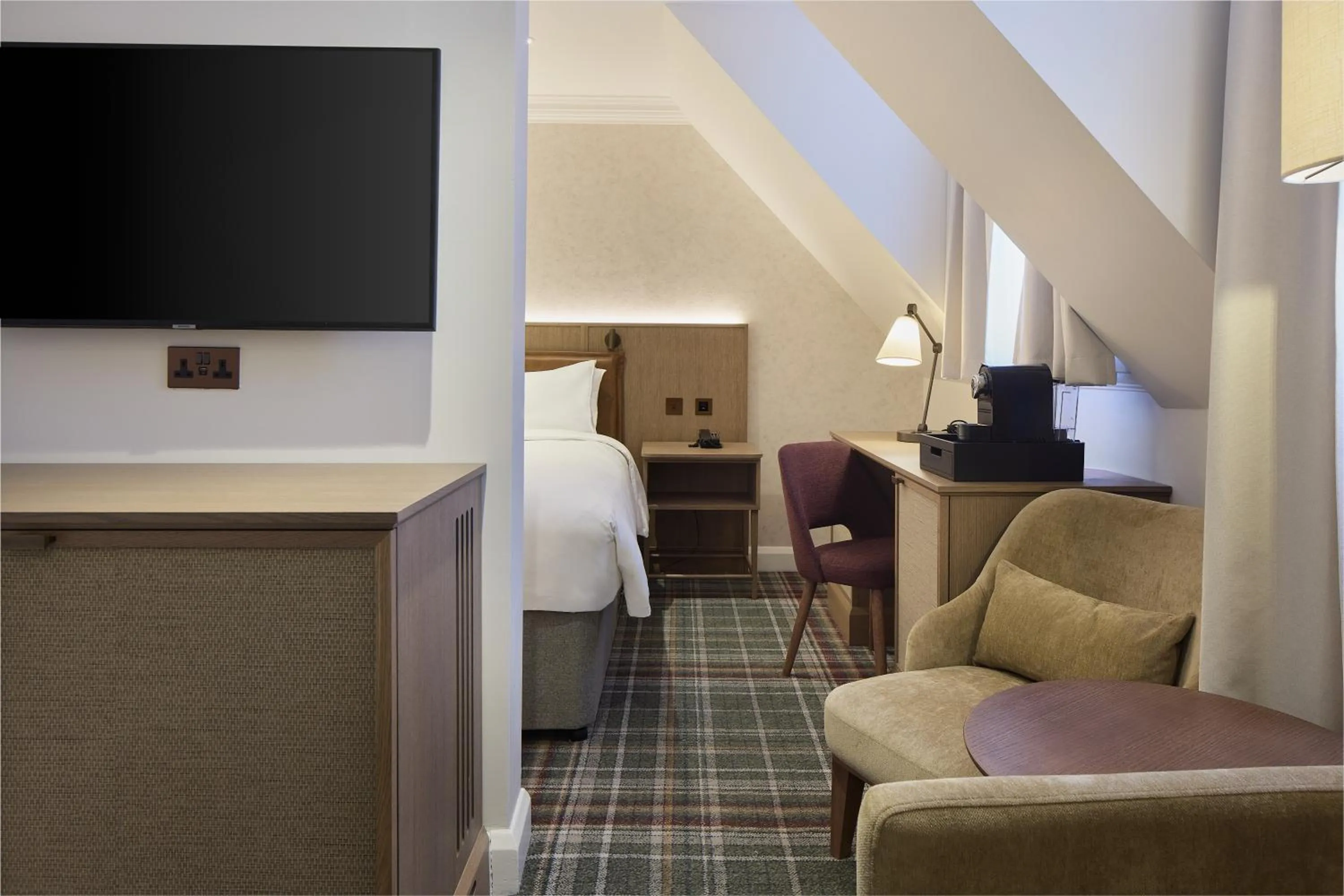 Communal lounge/ TV room in Radisson Blu Hotel, London Tottenham Court Road