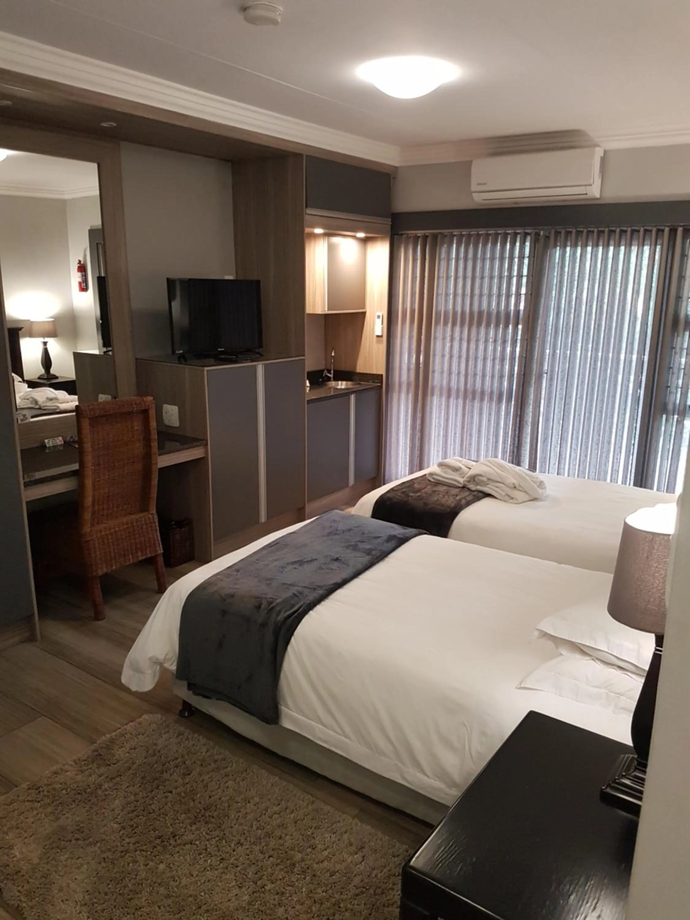 Bed in Cornerstone Guest Lodge