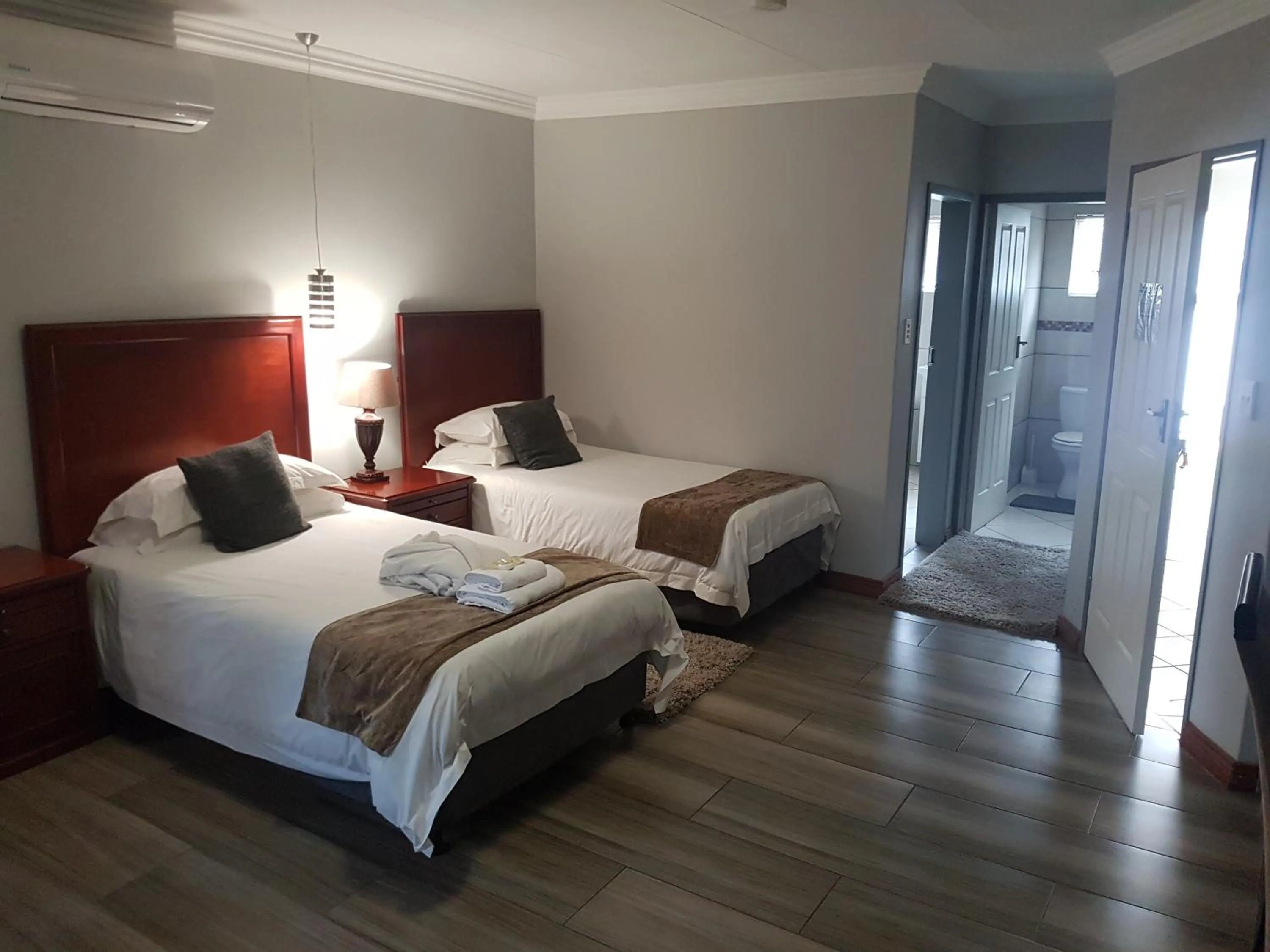 Bed in Cornerstone Guest Lodge