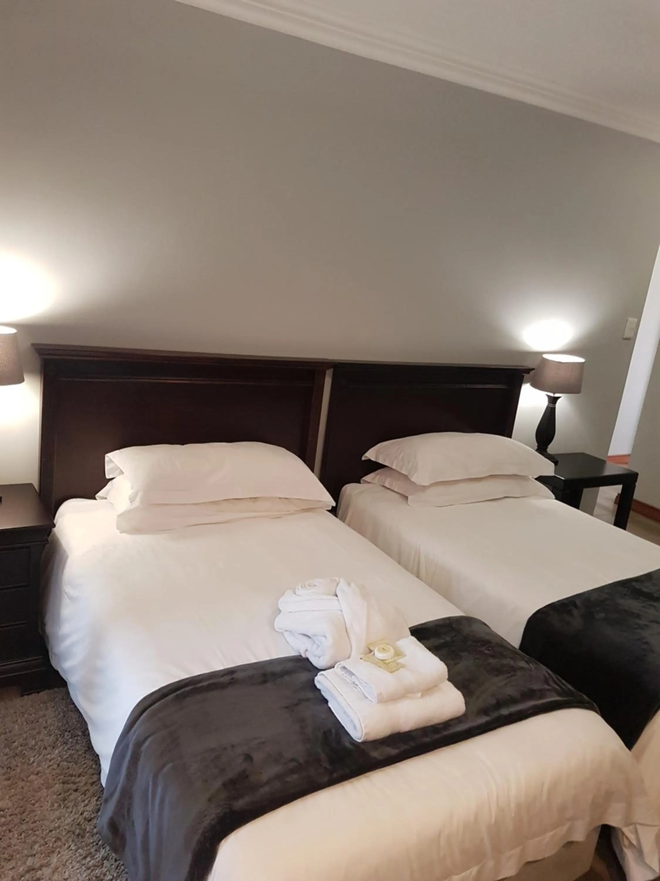 Bed in Cornerstone Guest Lodge
