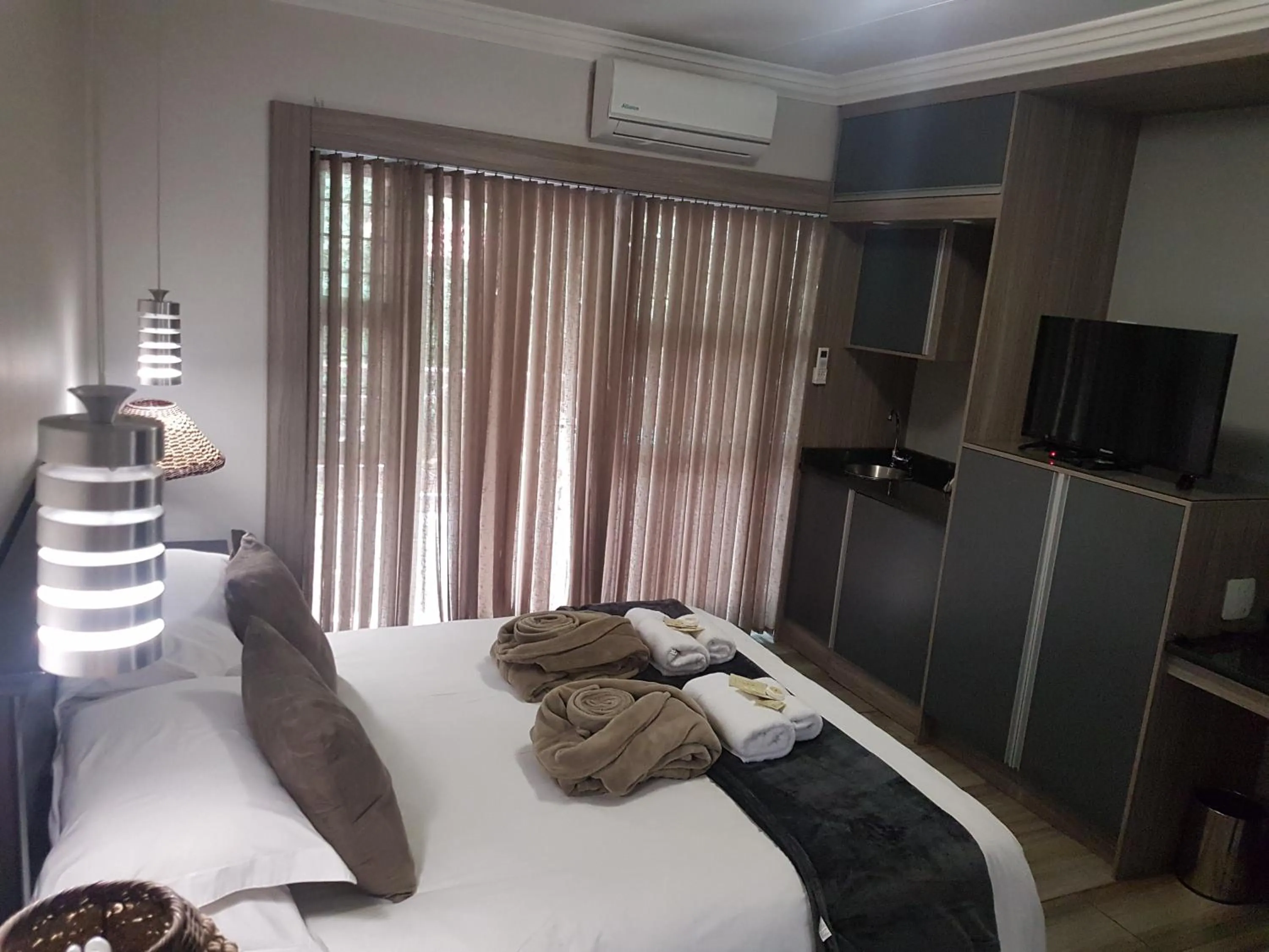 Bed in Cornerstone Guest Lodge